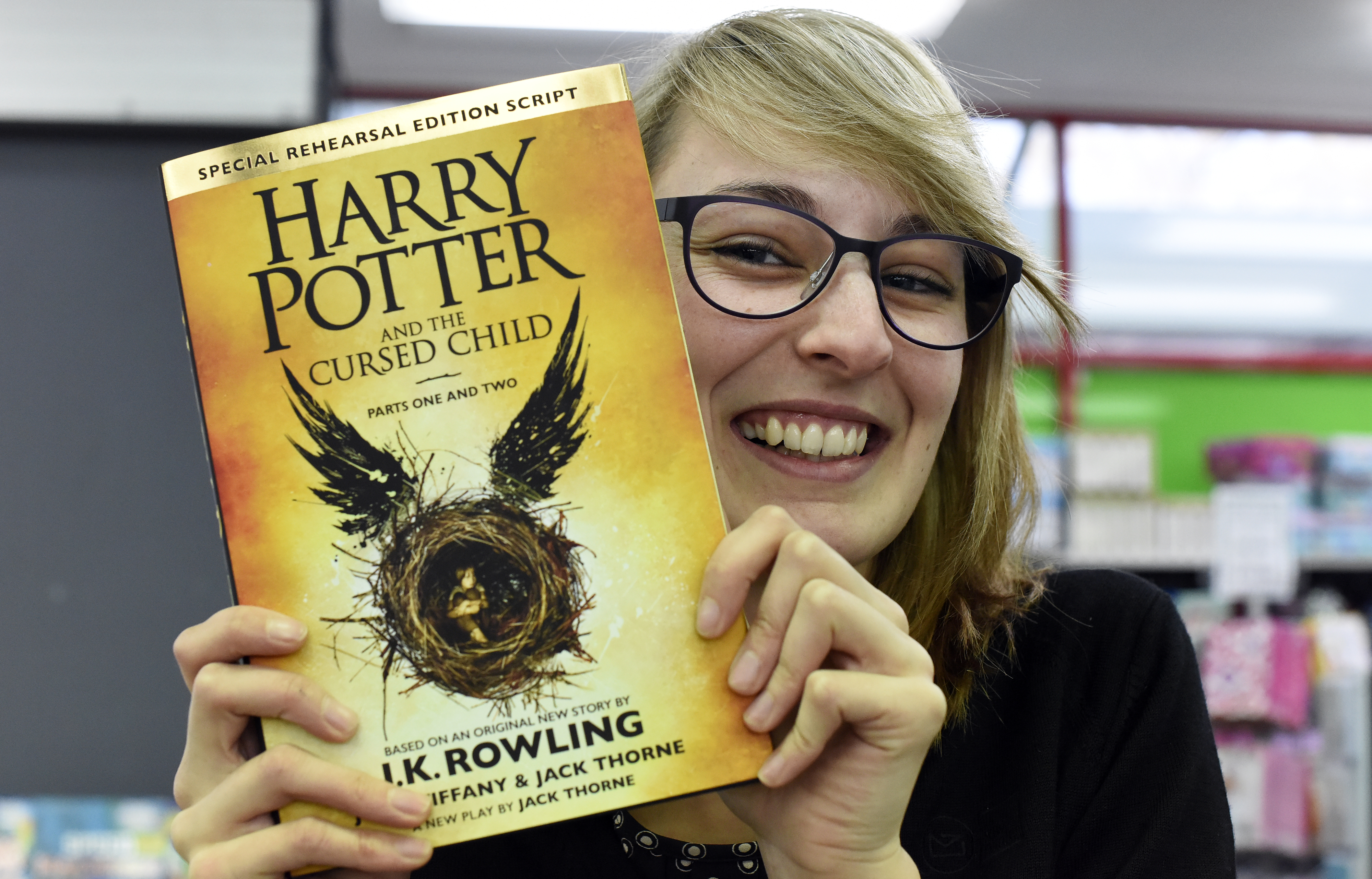 Harry Potter fan Stevie Price with a copy of Harry Potter and the Cursed Child. Photo / George Novak