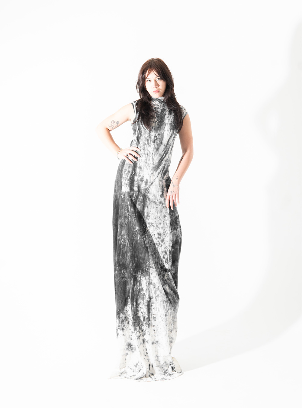 This dress by Daniel Bradley, modelled by student Nevada Wolfgramm, utilises faulty fabric made from hemp and organic cotton and was coloured with excess dye during the youth-focused ‘As We Watch The World Go By’ runway. It was handstitched with waste organic cotton threads snipped and saved during production processes for other pieces.