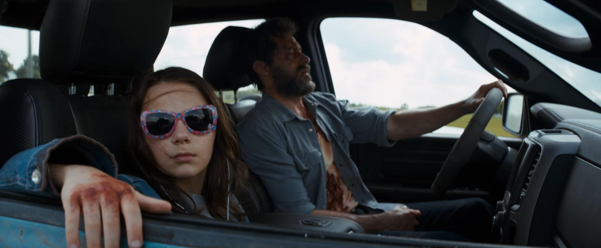 Dafne Keen, left, co-stars as Laura in the well-received superhero movie. Photo/YouTube