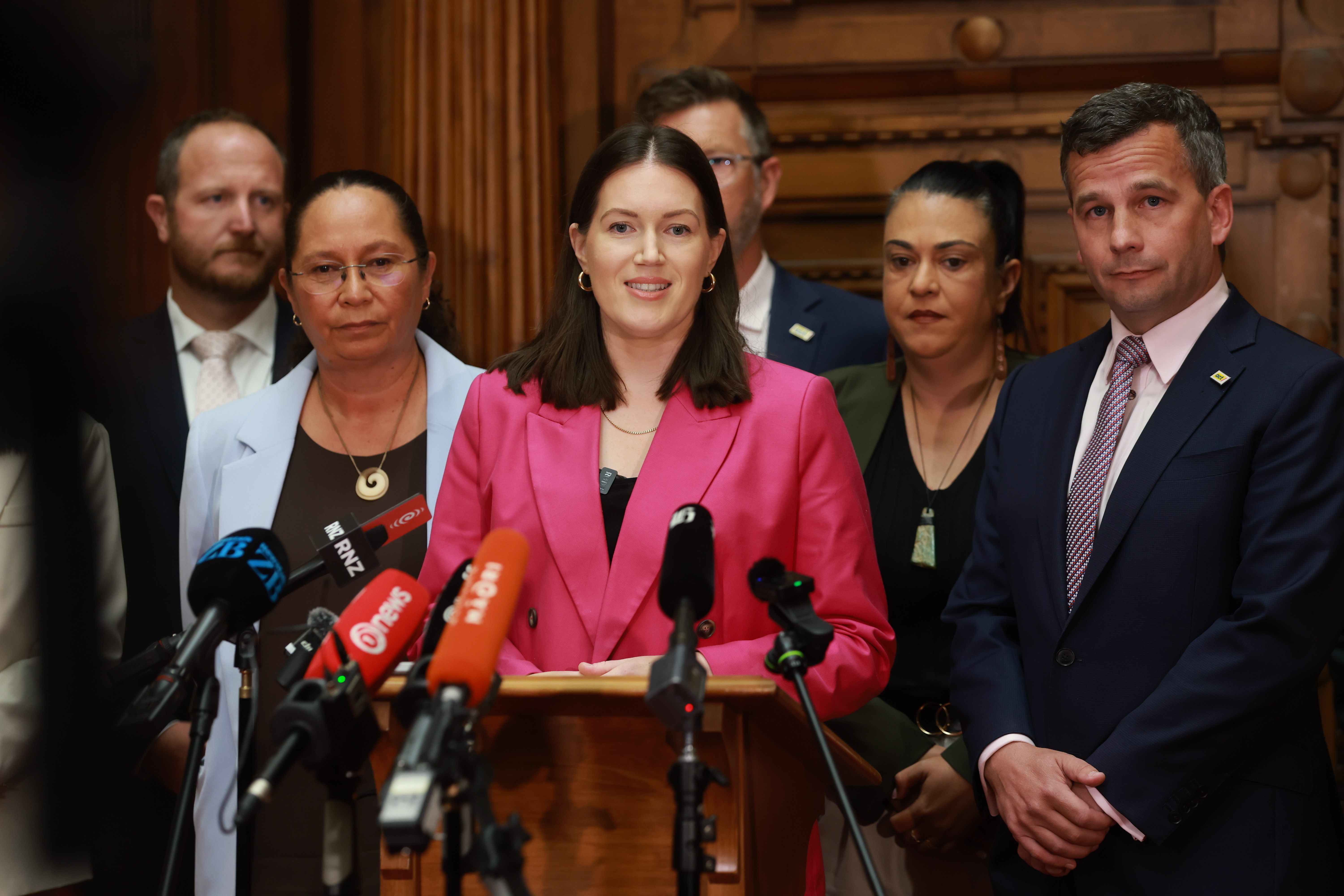Act deputy leader Brooke van Velden, surrounded by her party colleagues, is leading the drive for major health and safety reforms. Photo / Mark Mitchell