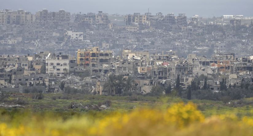 Destroyed buildings stand in the Gaza Strip as seen from southern Israel. Photo / AP