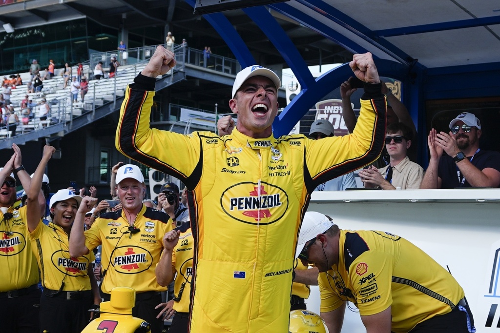 Scott McLaughlin celebrates after winning the pole for the Indianapolis 500 auto race at Indianapolis Motor Speedway in the fastest ever qualifying time. Photo / AP