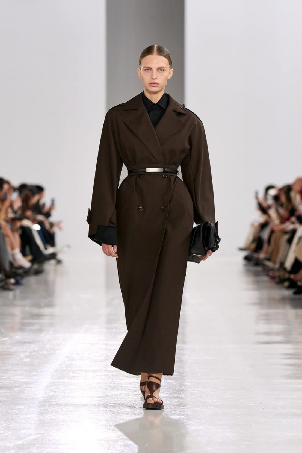 A brown coat with sandals proved an interesting proposition for spring dressing. Photo / @maxmara