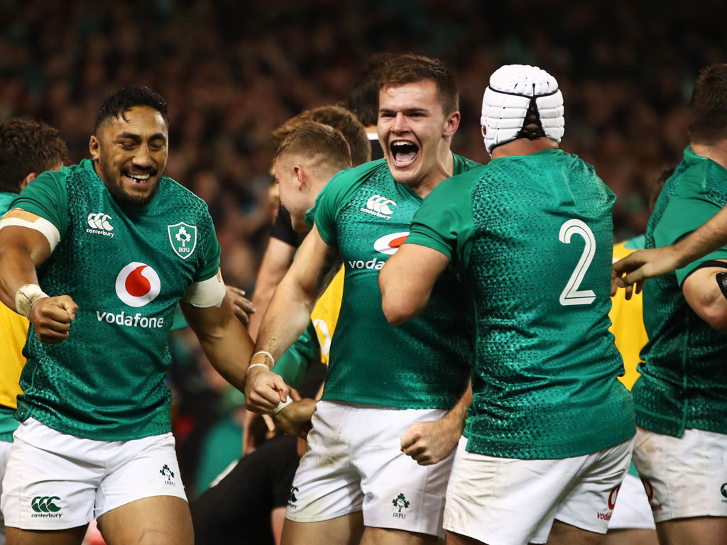 Jacob Stockdale of Ireland (C) celebrates with team mates Bundee Aki and Rory Best as he scores their first try.Photo / Getty Images.