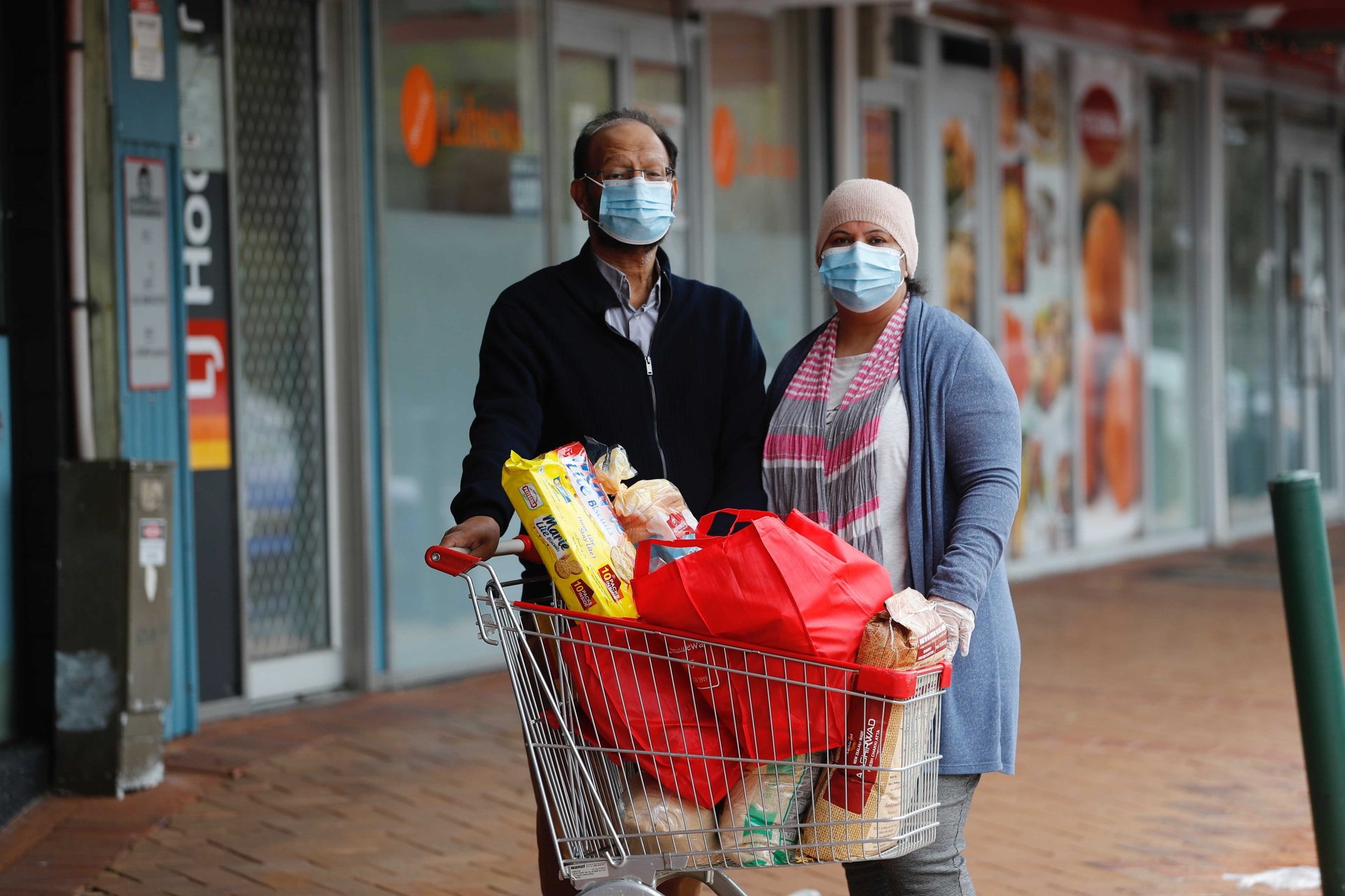 Davinder and Jyoti Singh Rahal with $147 of groceries they bought for an elderly person in their community. Photo / Dean Purcell.