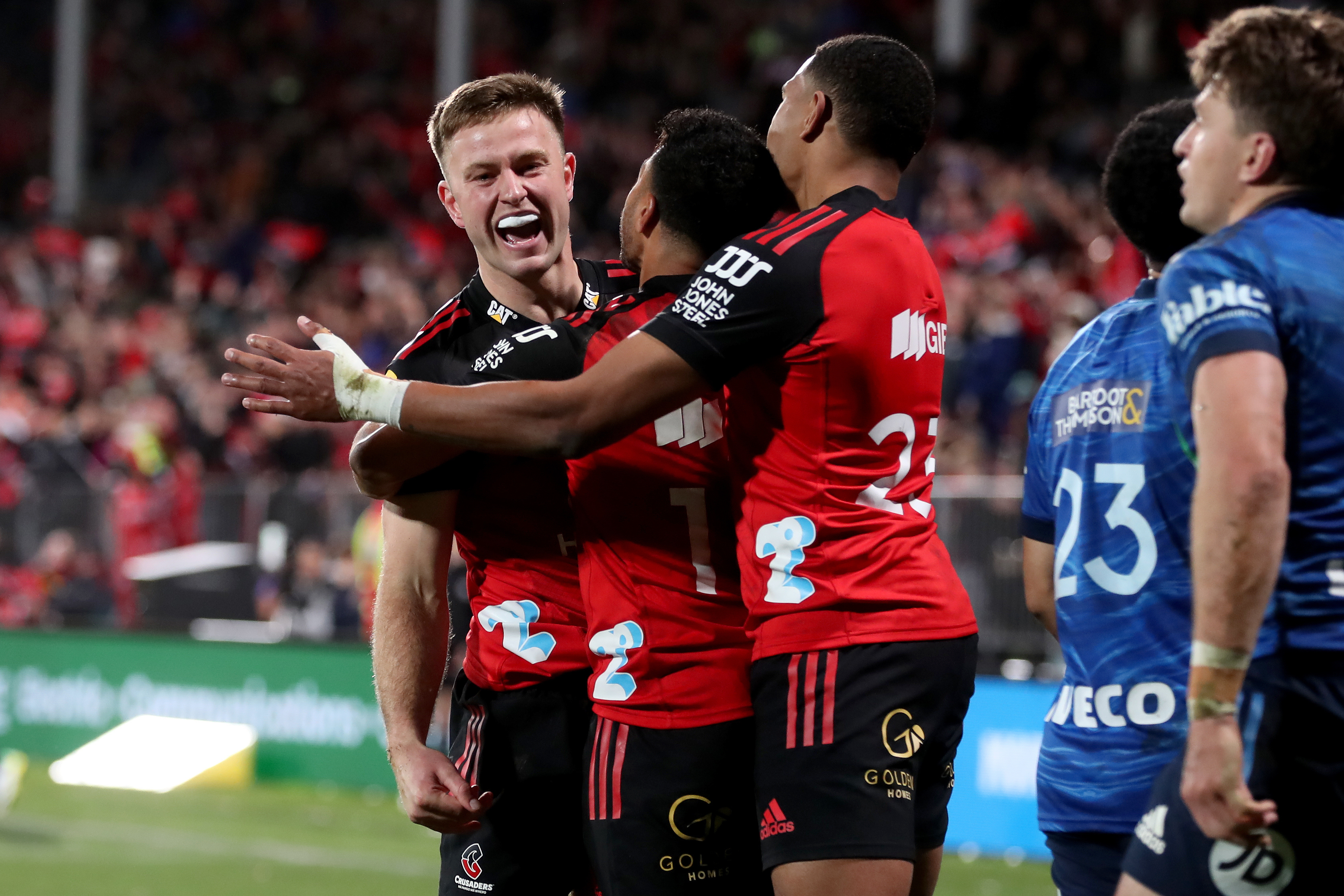 Crusaders replacement Fergus Burke celebrates his try against the Blues. Photo / Photosport 