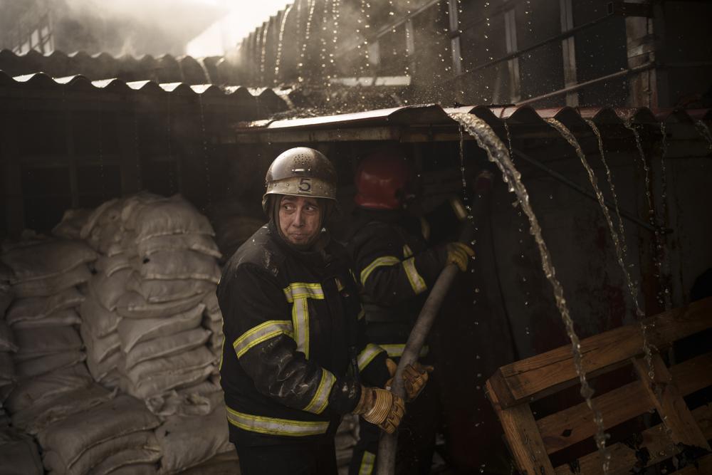 Firefighters battle a fire following a Russian attack in Kharkiv, Ukraine, March 25, 2022. Photo / AP