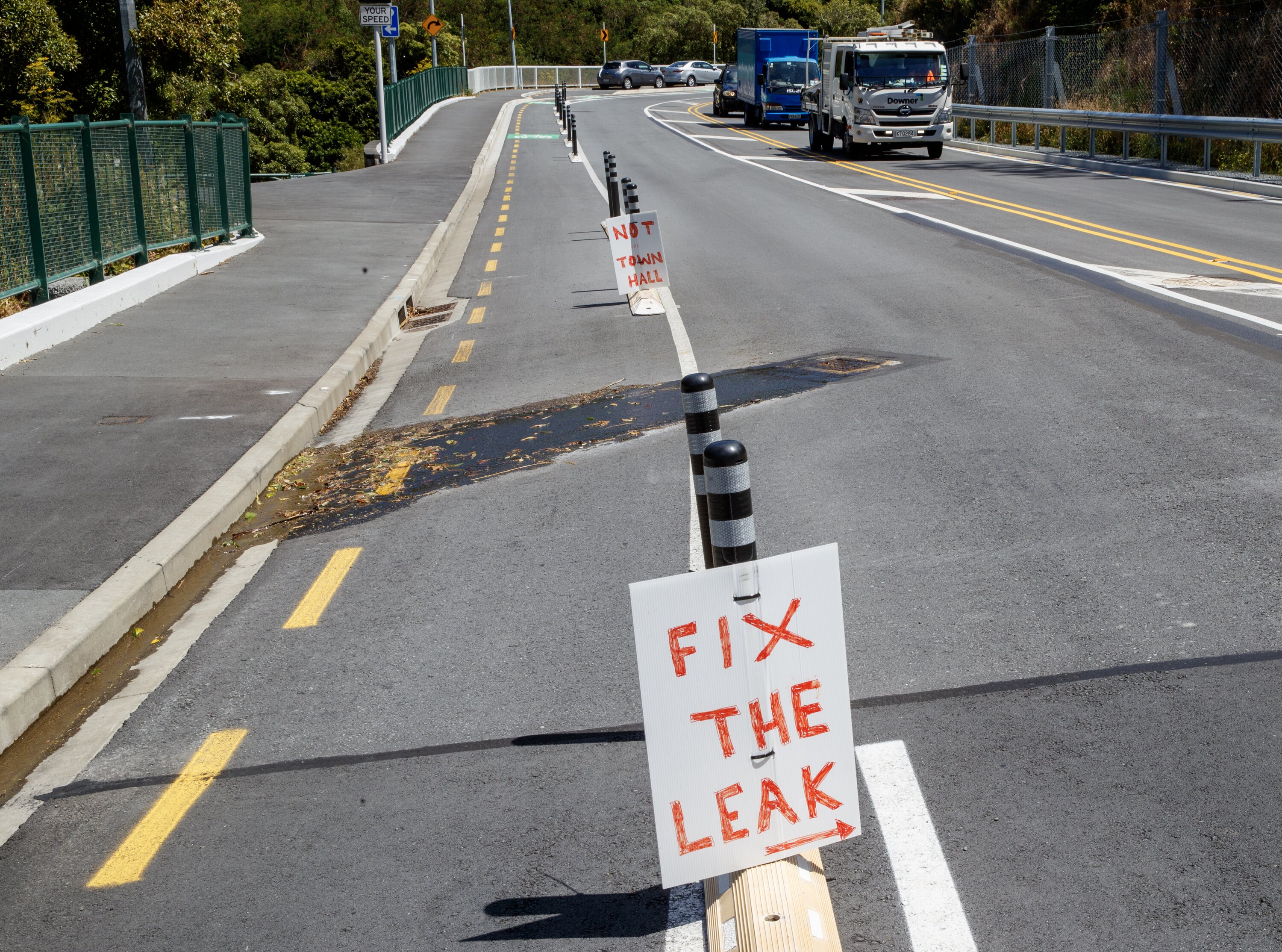 A message for Wellington City Council next to a water leak on Ngaio Gorge Road last summer. Photo / Mark Mitchell