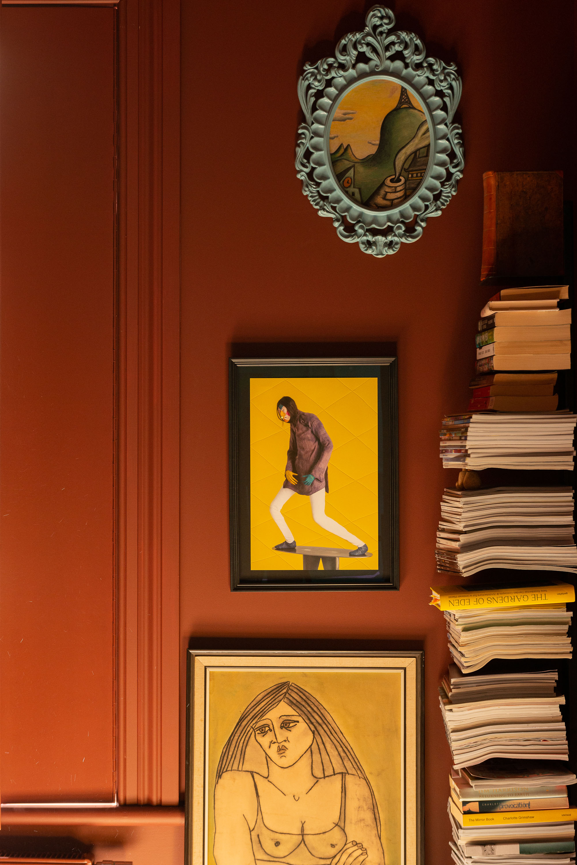The first piece Sarah and Philippe bought, an artwork by Fane Flaws, in the blue oval frame. Immediately below, is a print by Francis Upritchard, and below that, 'Grumpy Girl', a random purchase by Philippe’s parents. Photo / Cave Bureau