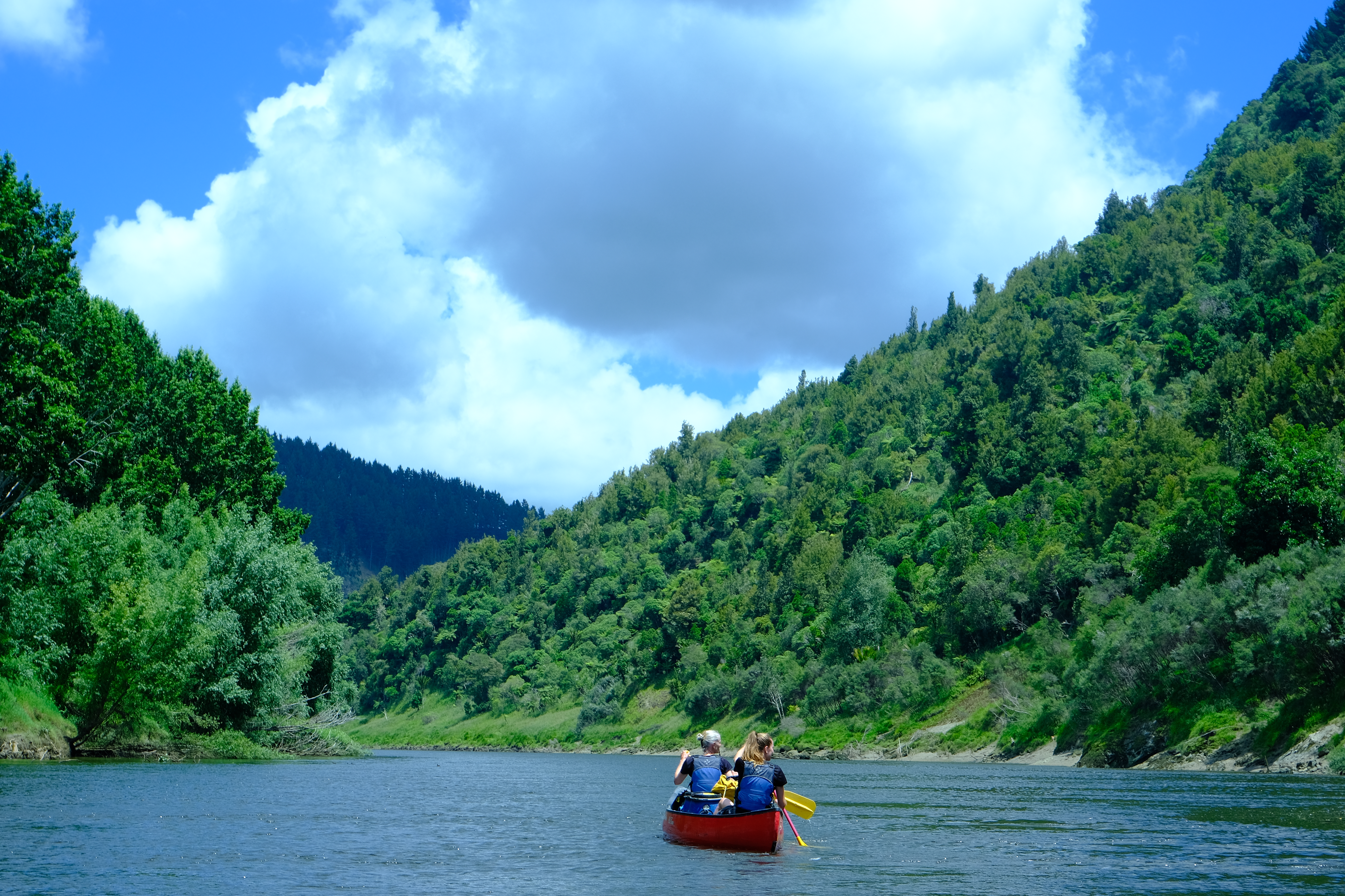 Kayakers make their way down the Whanganui River, which flows through native bush and into deep cultural heritage. Photo / Tsewang Nuru Sherpa