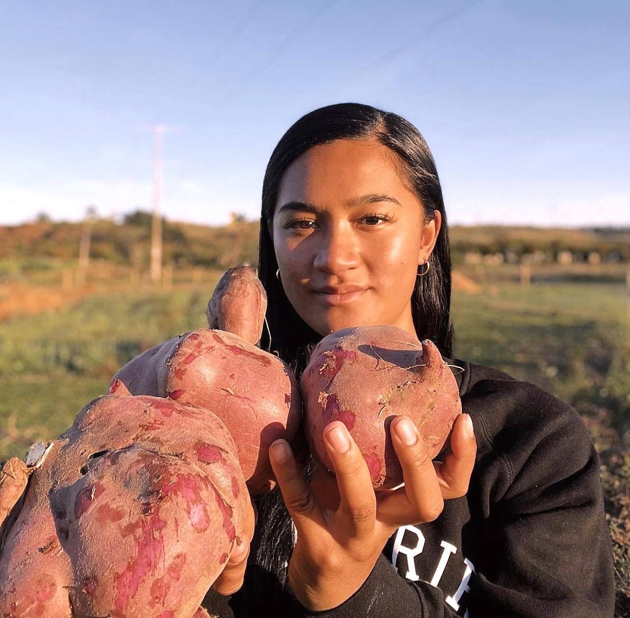 Hana Maipi-Clarke joining her whānau and community in a kumara harvest. Photo / Supplied