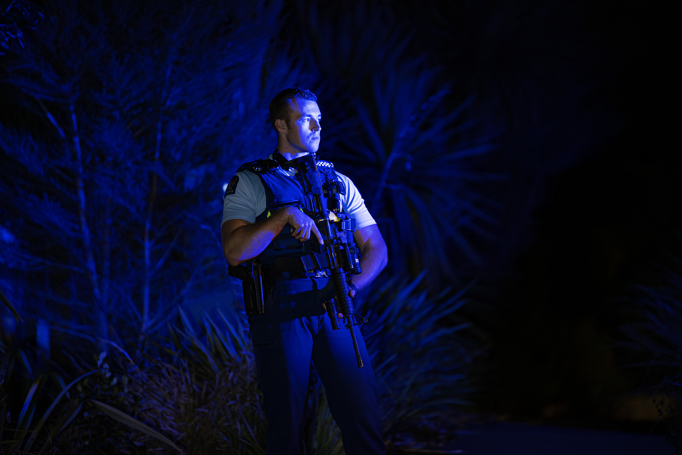 Armed officers block Mackay Dr in Greenhithe following reports of an earlier kidnapping in Beach Haven. Photo / Hayden Woodward