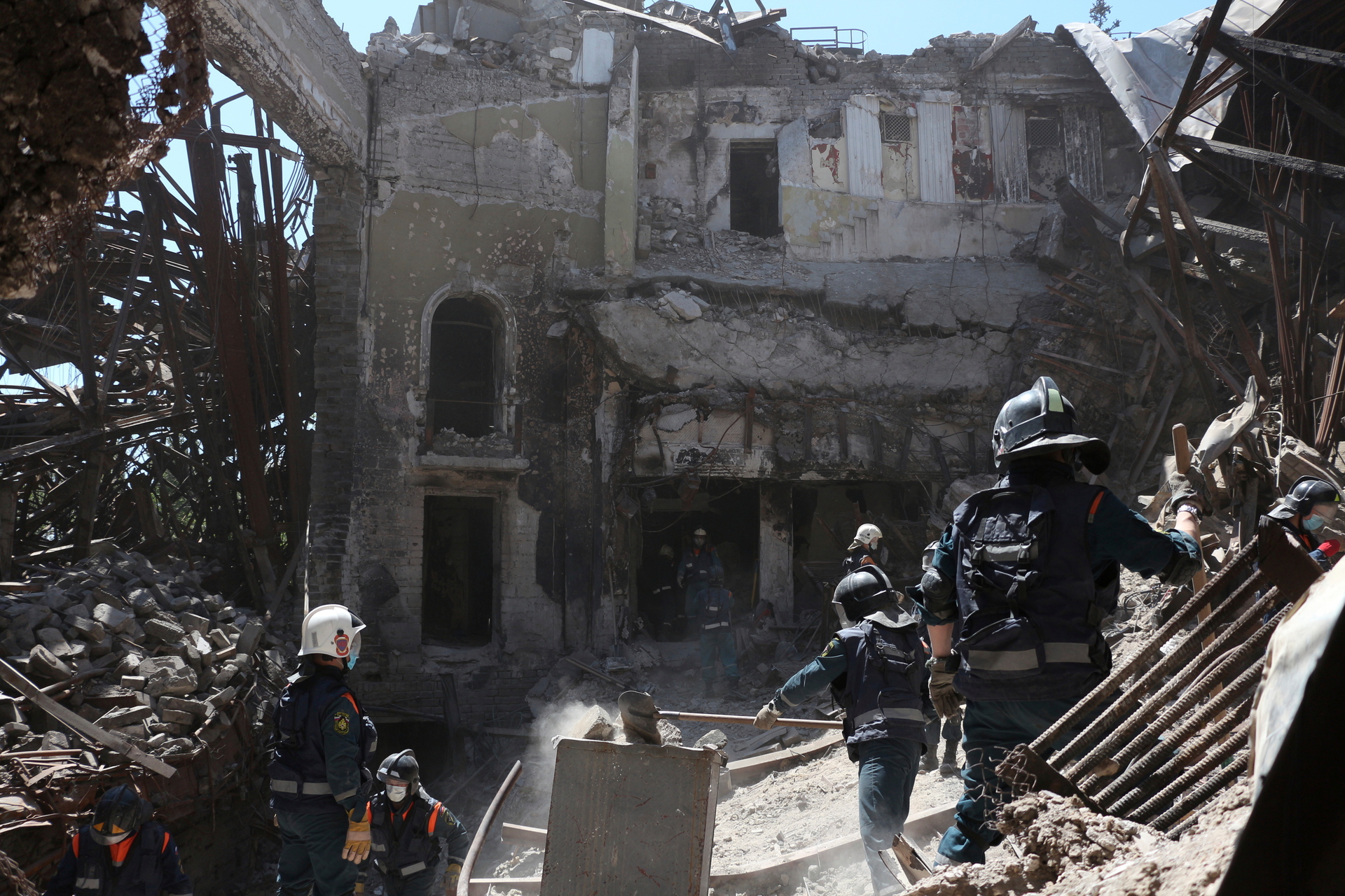 Donetsk People Republic Emergency Situations Ministry employees clear rubble at the side of the damaged Mariupol theatre during heavy fighting in Mariupol, in territory under the government of the Donetsk People's Republic, eastern Ukraine, on May 12. Photo / AP