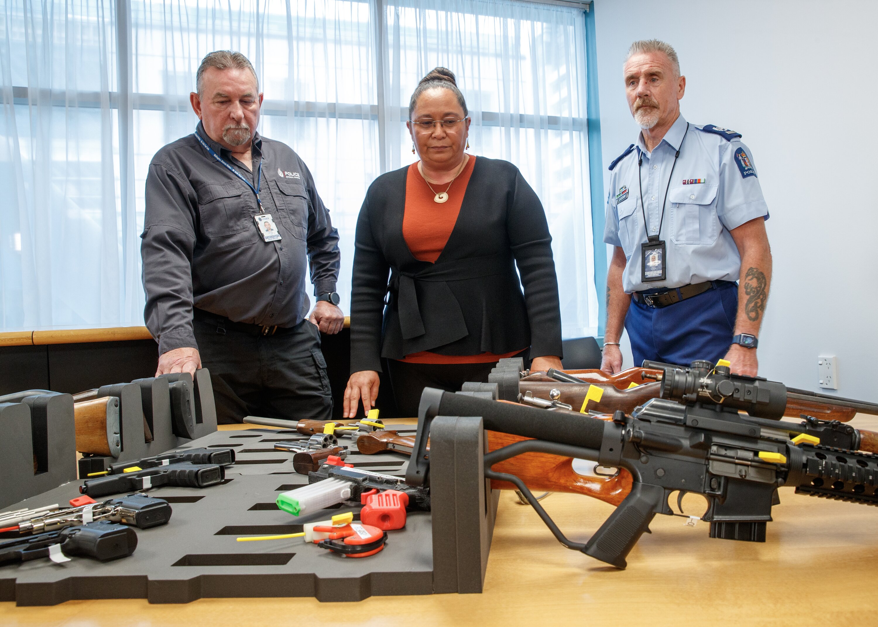 Associate Justice Minister Nicole McKee, with police staff, inspecting seized illegal firearms after announcing changes to Firearms Prohibition Orders law in March 2024. Photo / Mark Mitchell