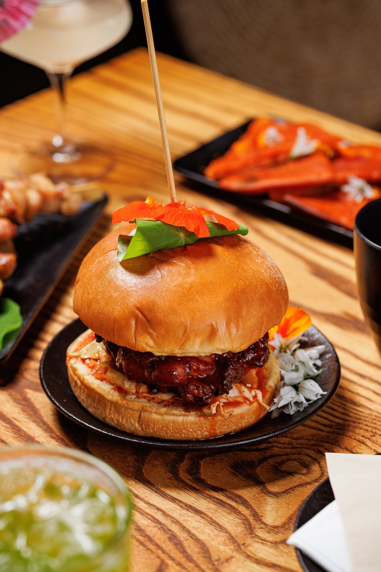 A fiery gochujang-soaked fried chicken burger bursting with Korean flavour - let down only by its oddly chilly buns. Photo / Babiche Martens