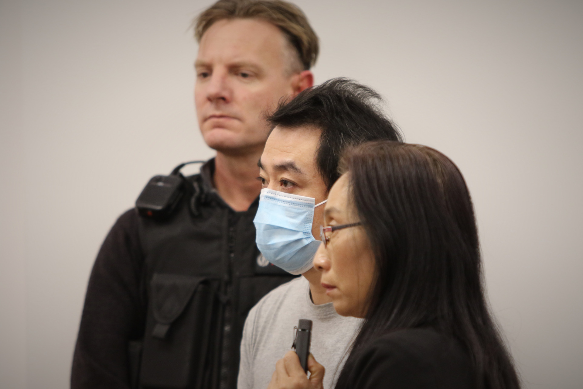 Australian hairdresser He Sha (centre in mask). Photo / Sam Hurley