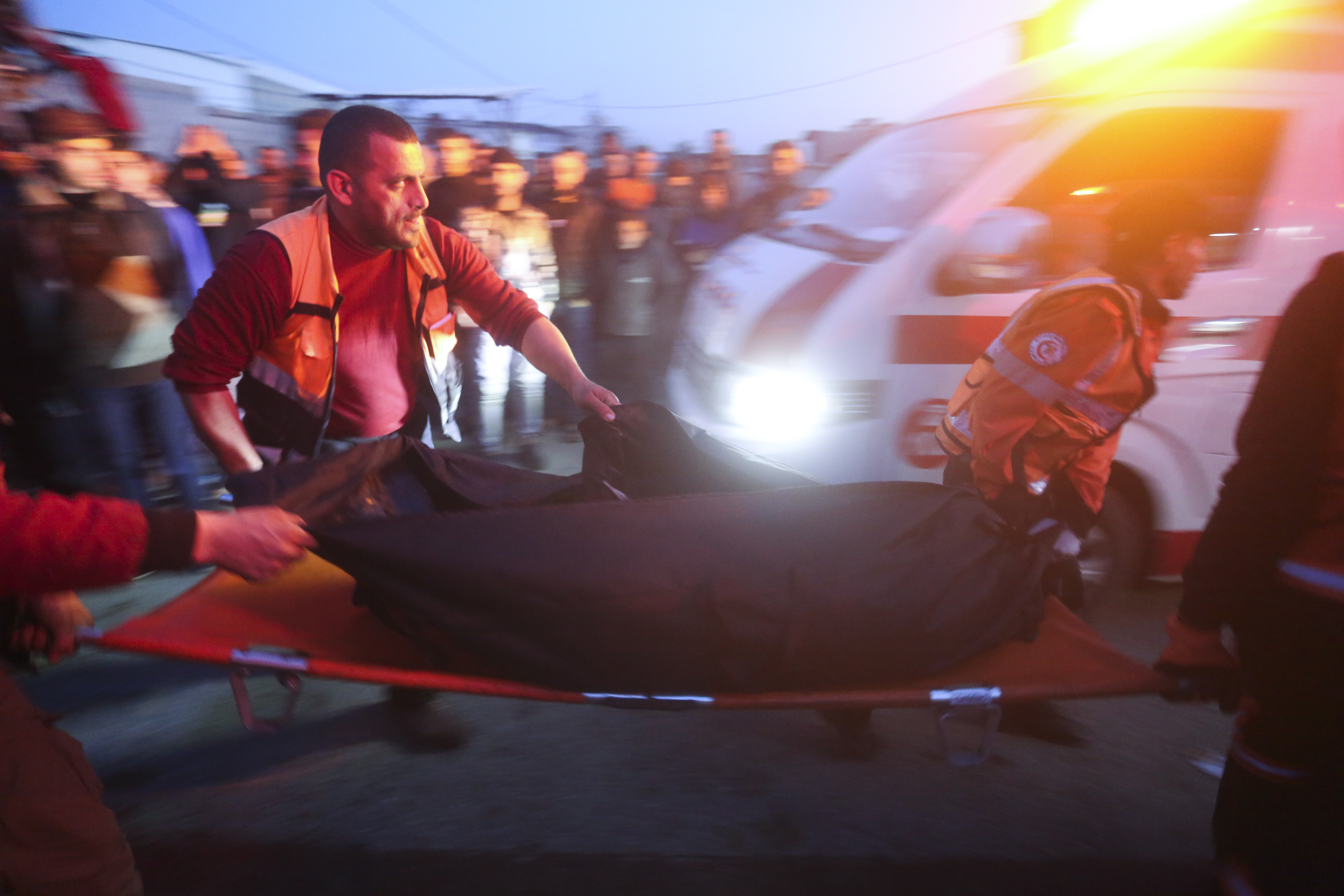Palestinians remove a body from a car that was hit by an Israeli airstrike in Rafah, Gaza Strip. Photo / AP