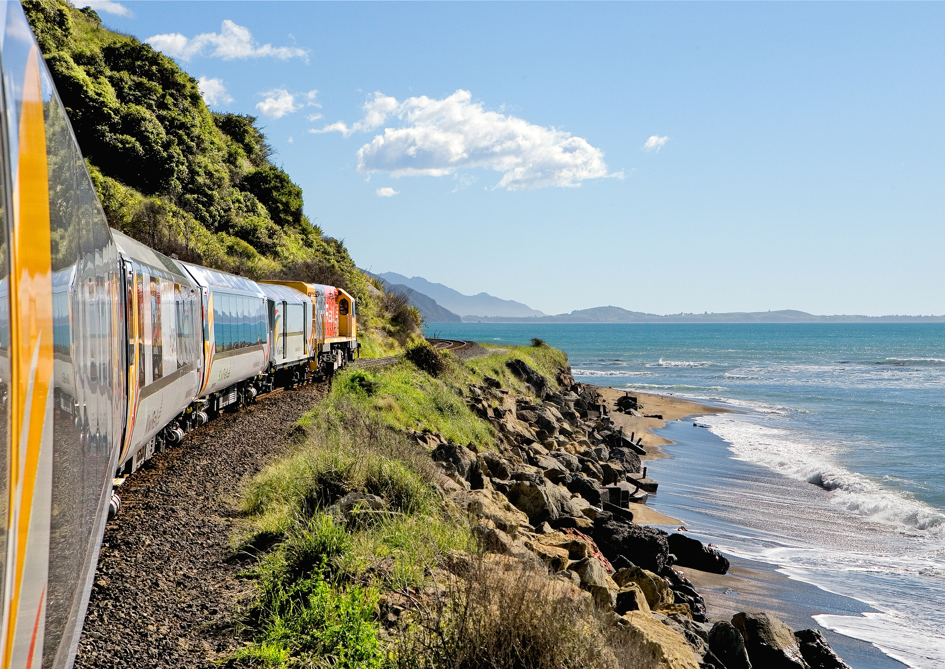 The Coastal Pacific rail service passenger train on Kaikoura coast.