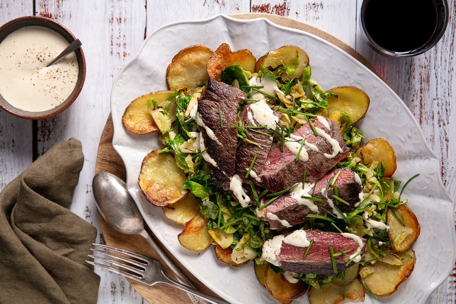 Crispy potatoes, roasted Brussels sprouts and buttery steak. Photo / Babiche Martens