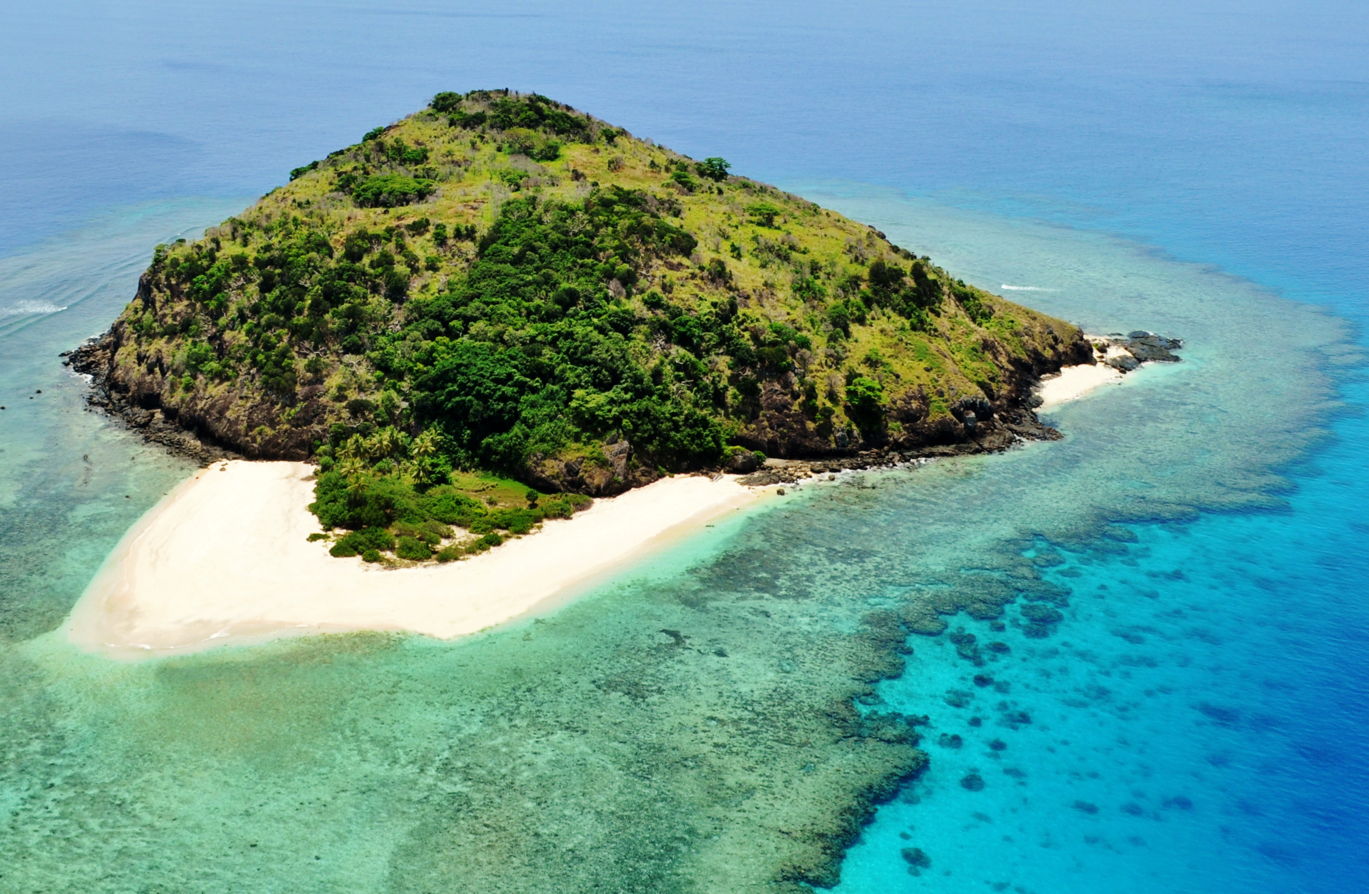 Aerial view of Yadua Island, Fiji, with its feature white sandy beach in the foreground.