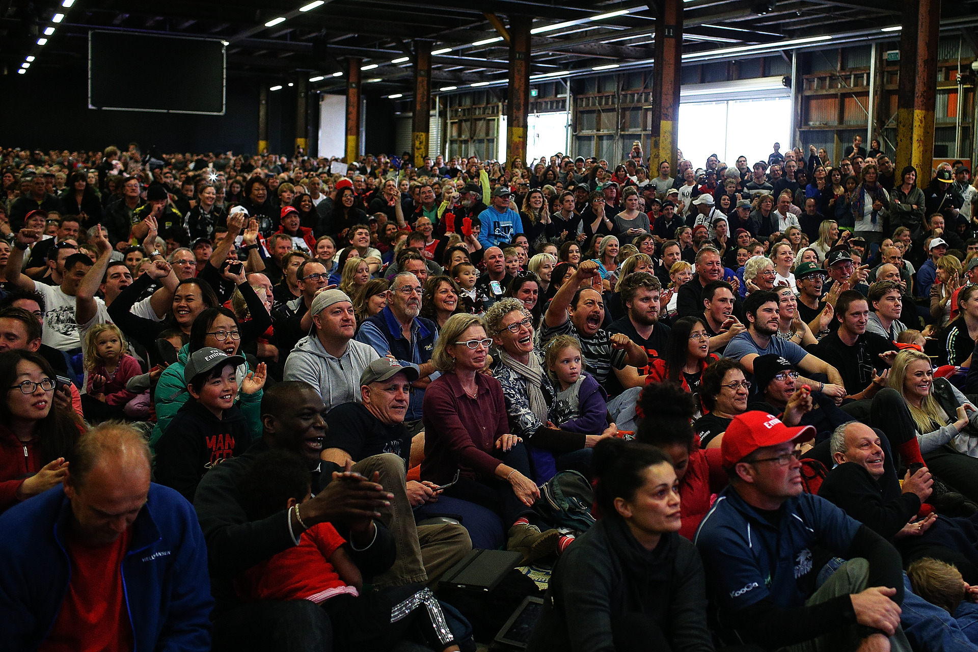 New Zealand fans watch race 13 of the America's Cup between Emirates Team New Zealand and Oracle Team USA at Shed 10. Photo / Getty Images.