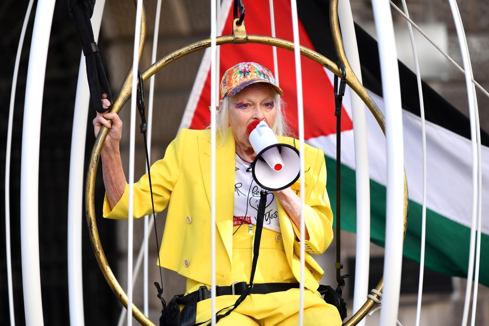 Vivienne Westwood is suspended 10 Feet high inside giant bird cage in protest for Julian Assange at Old Bailey for her 79th birthday in 2020. Photo / Getty Images