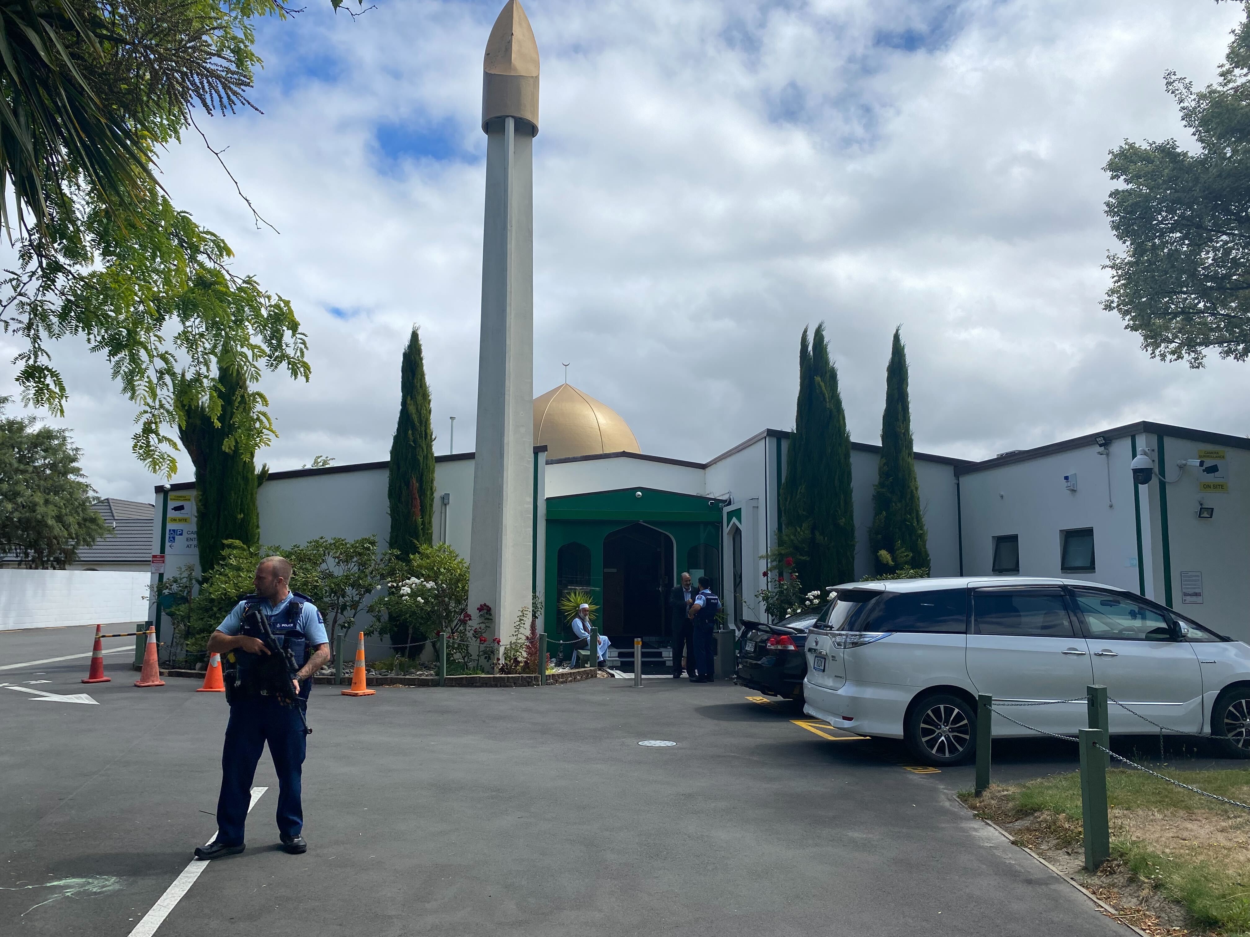 An armed police officer stands guard outside the Al Noor Mosque, Christchurch. Photo / Sam Sherwood