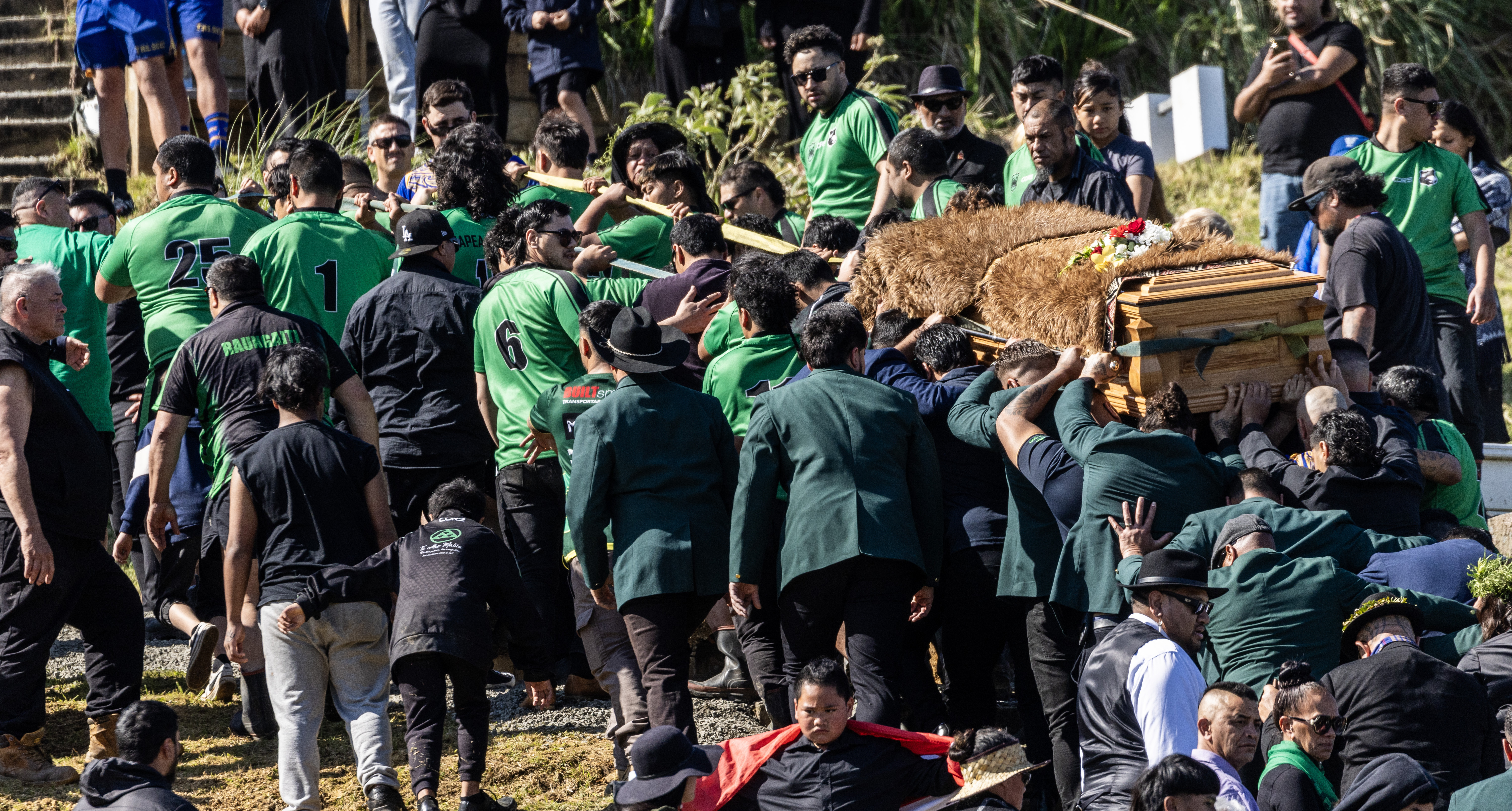 Tūheitia's casket is taken towards the burial place on the maunga. Photo / Mike Scott