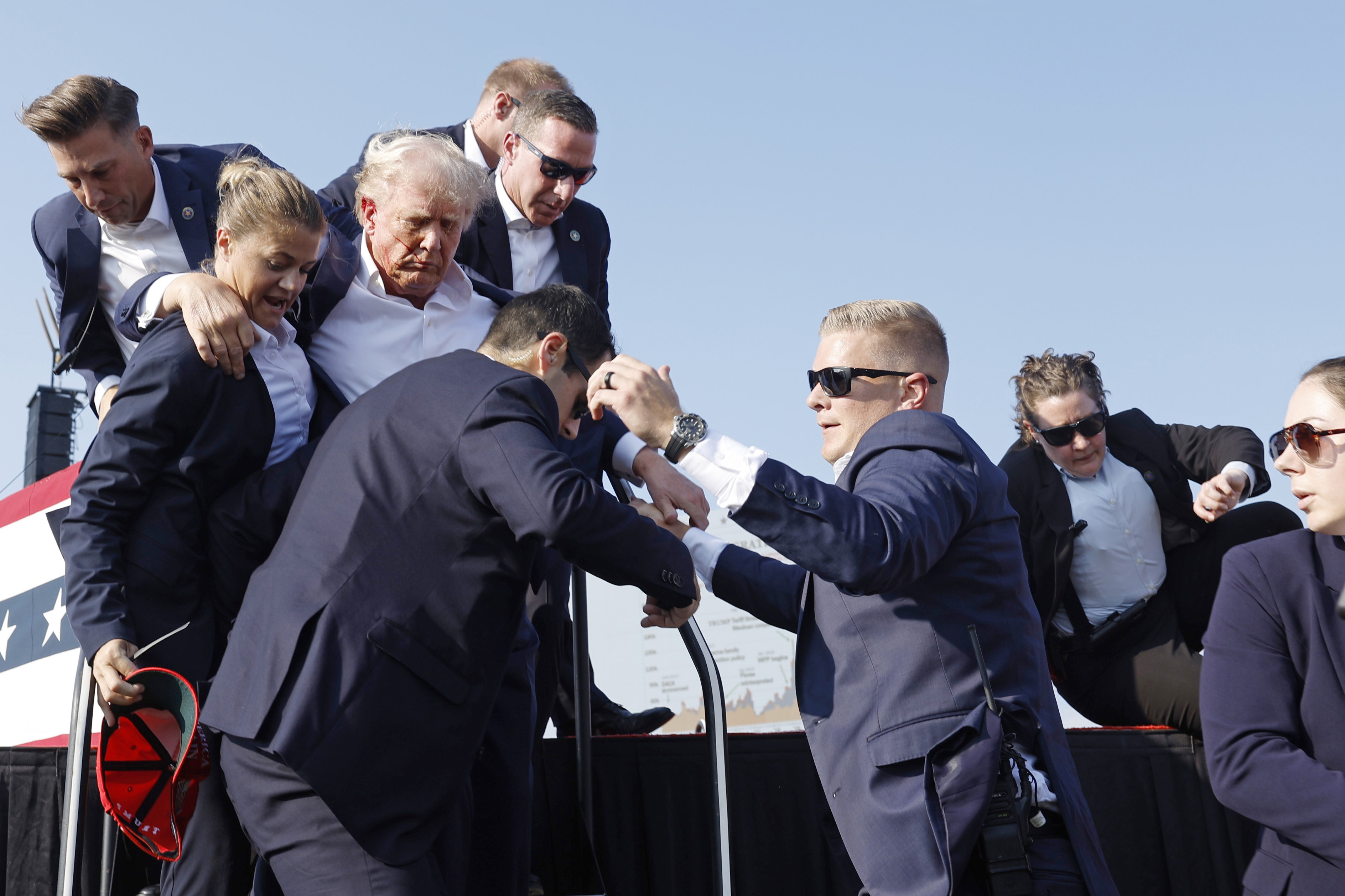 Republican presidential candidate and former President Donald Trump is rushed off stage. Photo / Getty Images