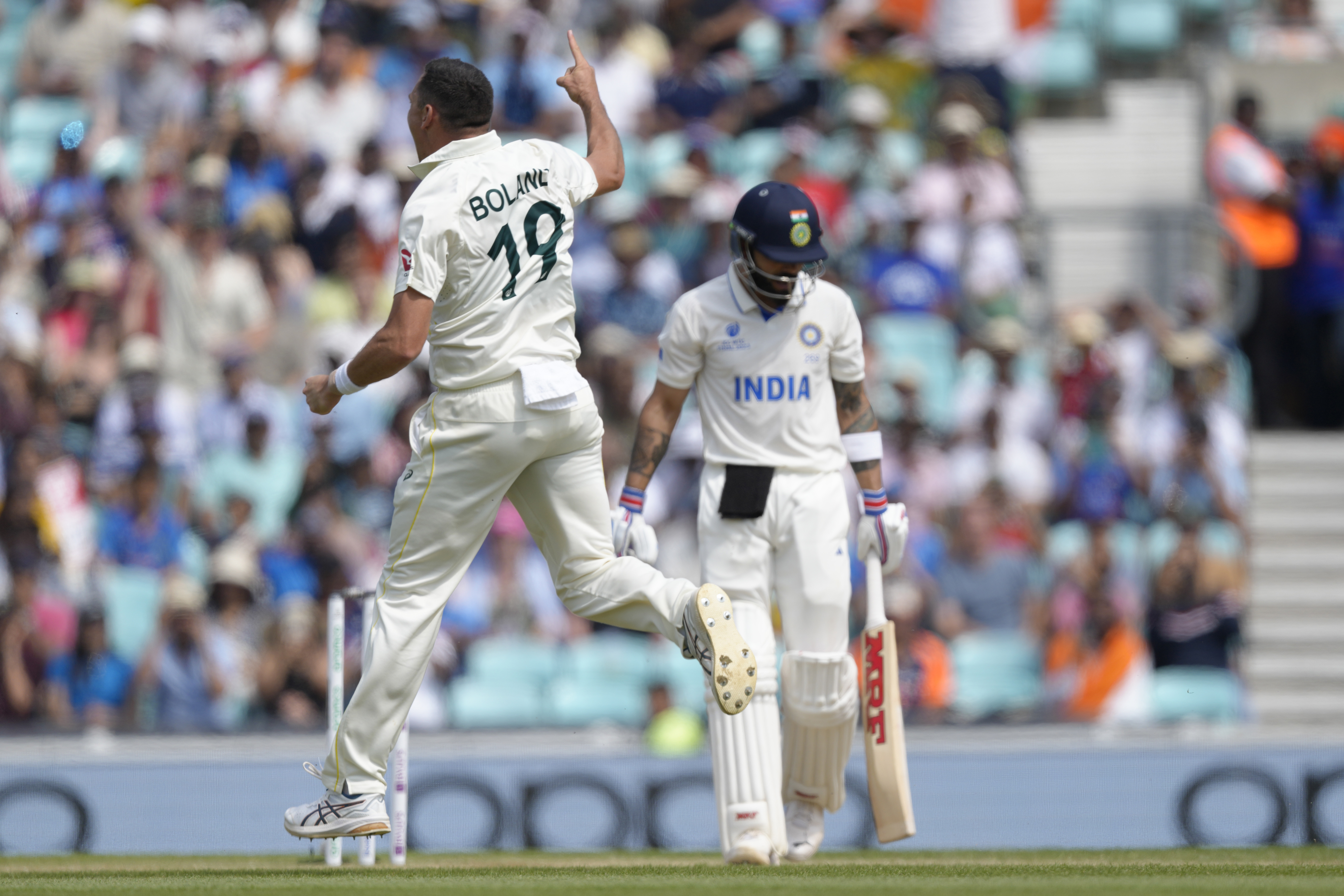 Australia's Scott Boland celebrates taking the wicket of India's Virat Kohli caught by Australia's Steven Smith. Photo / AP