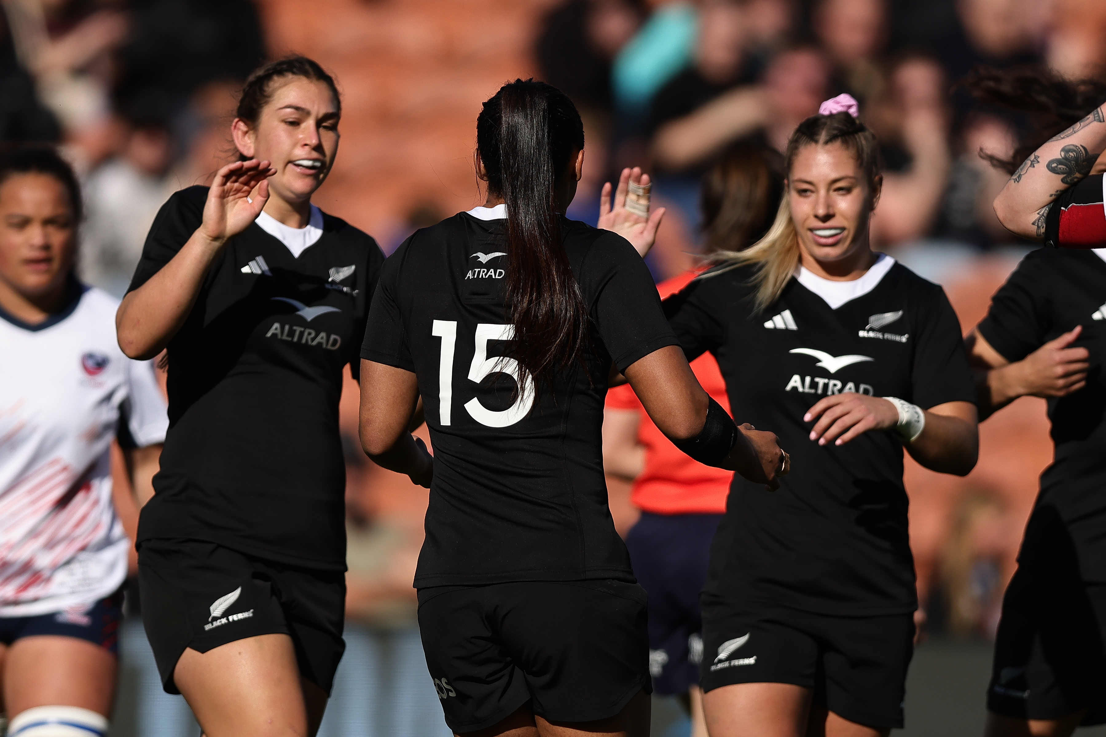 Georgia Ponsonby, Mererangi Paul and Amy du Plessis celebrate a try in the Black Ferns' win over USA. Photo / Photosport