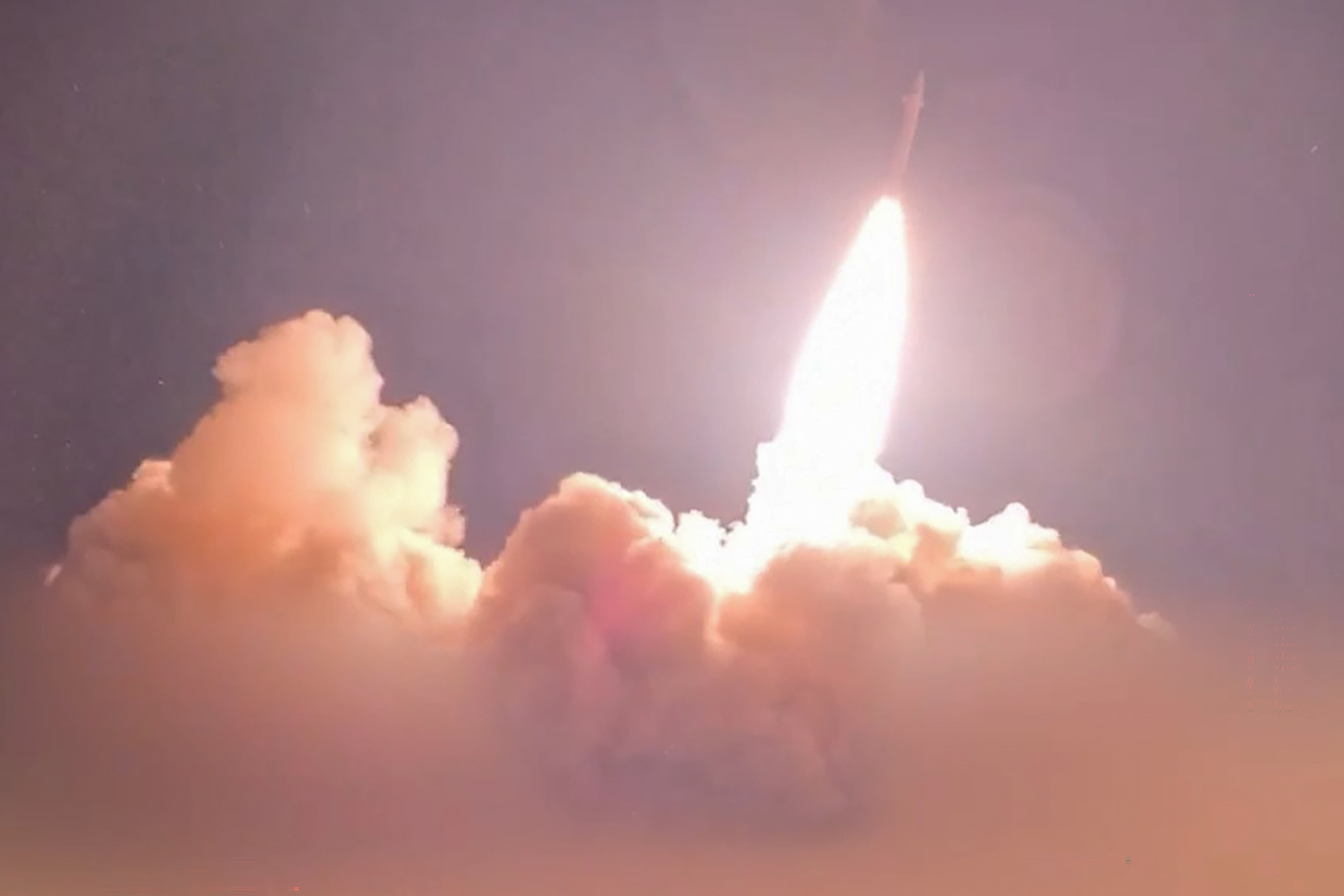 A still from video footage released on July 16 by Iran's Revolutionary Guards Corps (IRGC) shows a missile being launched from an undisclosed location towards US targets in Jordan, Kuwait and Bahrain. Photo via AFP
