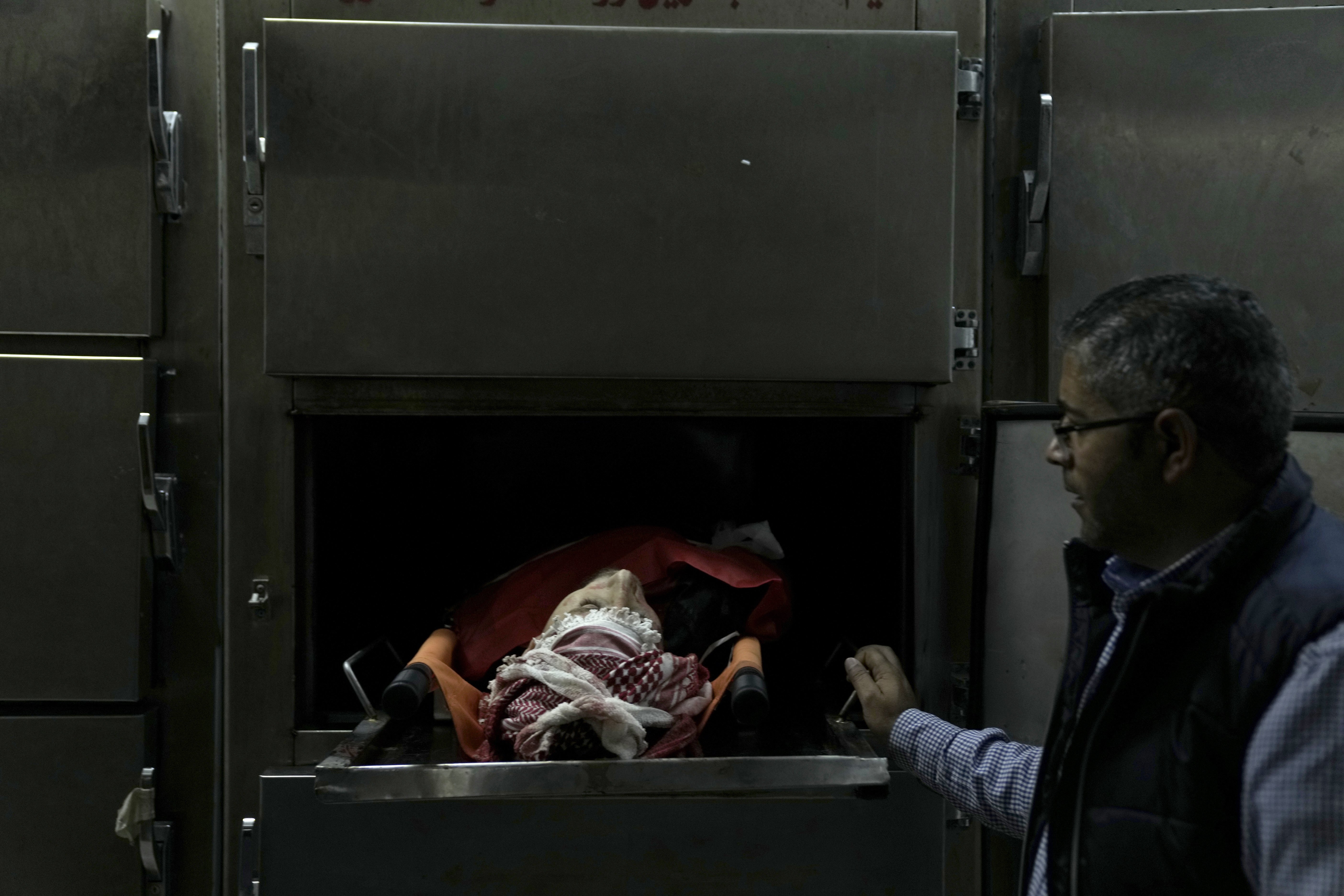 A Palestinian killed in a settler rampage lies in the morgue at the Palestine Medical Complex in the West Bank city of Ramallah. Photo / AP