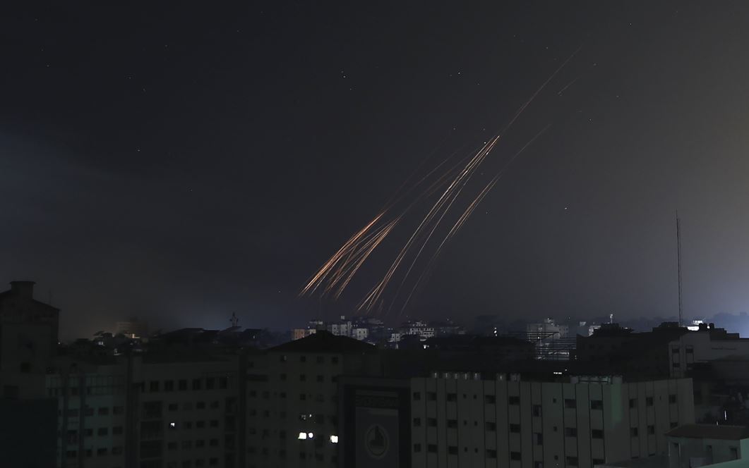 Tails of fire caused by Israeli bombardment fall over Gaza City. Photo / AP