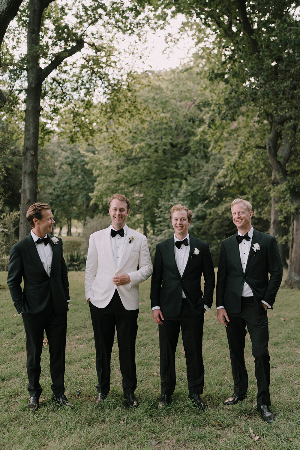 Daniel wore Ralph Lauren, while his groomsmen had matching jackets by Working Style. Photo / Danelle Bohane