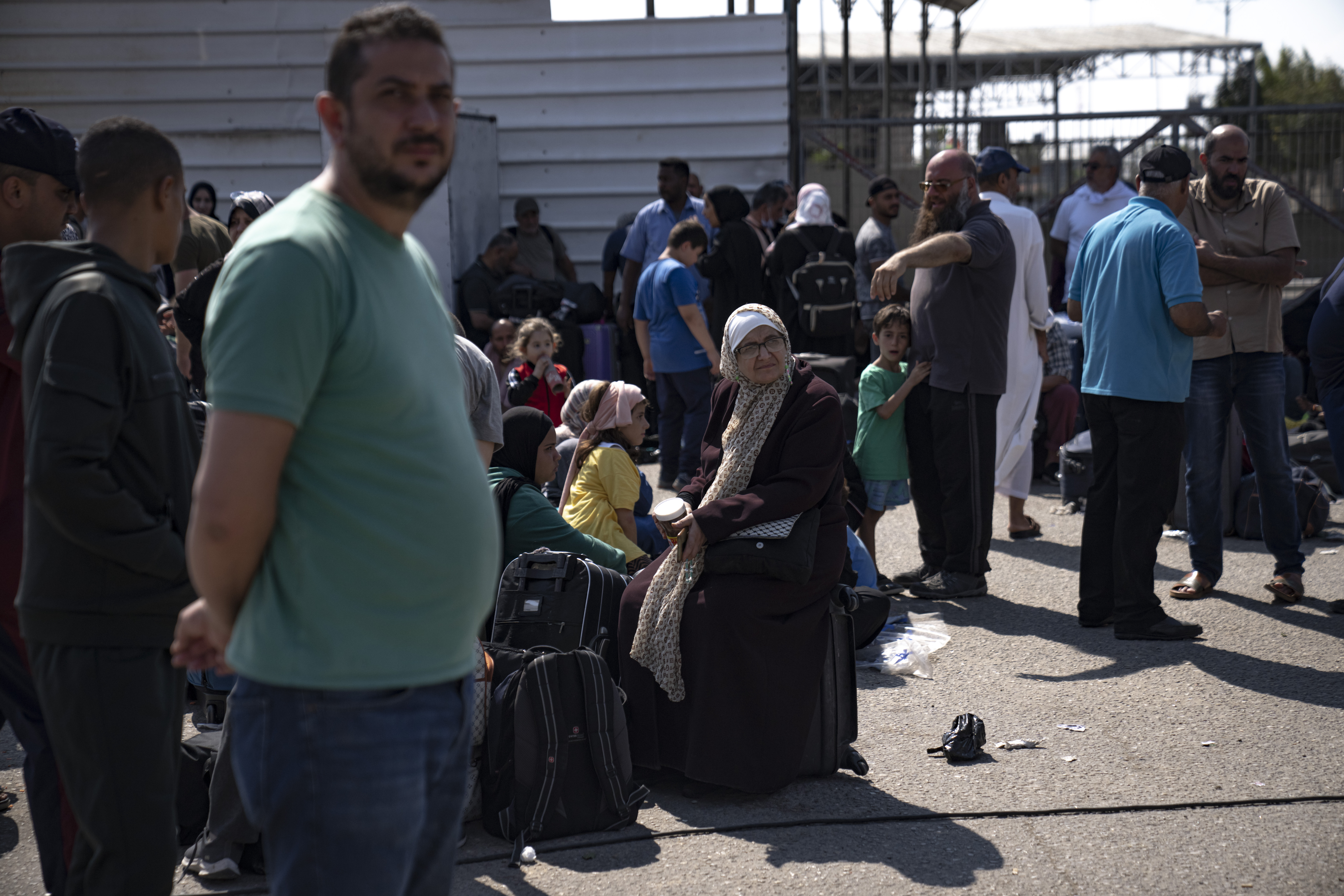 Palestinians wait to cross into Egypt at the Rafah border crossing in the Gaza Strip. Photo / AP