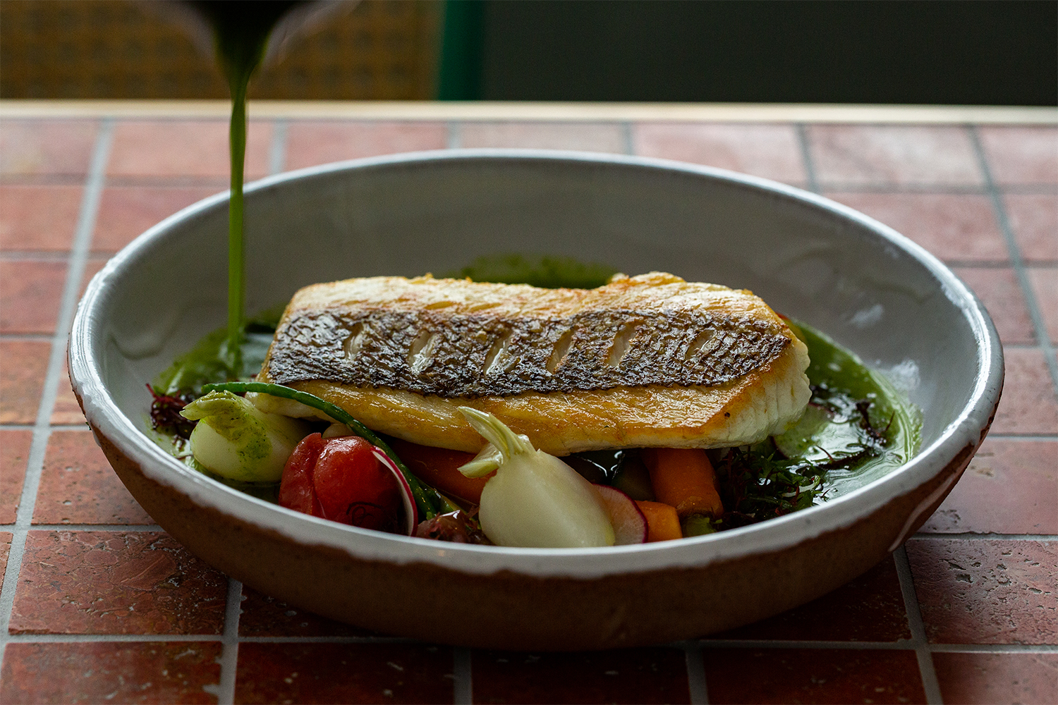 Leigh snapper with pistou and baby vegetables. Photo / Babiche Martens