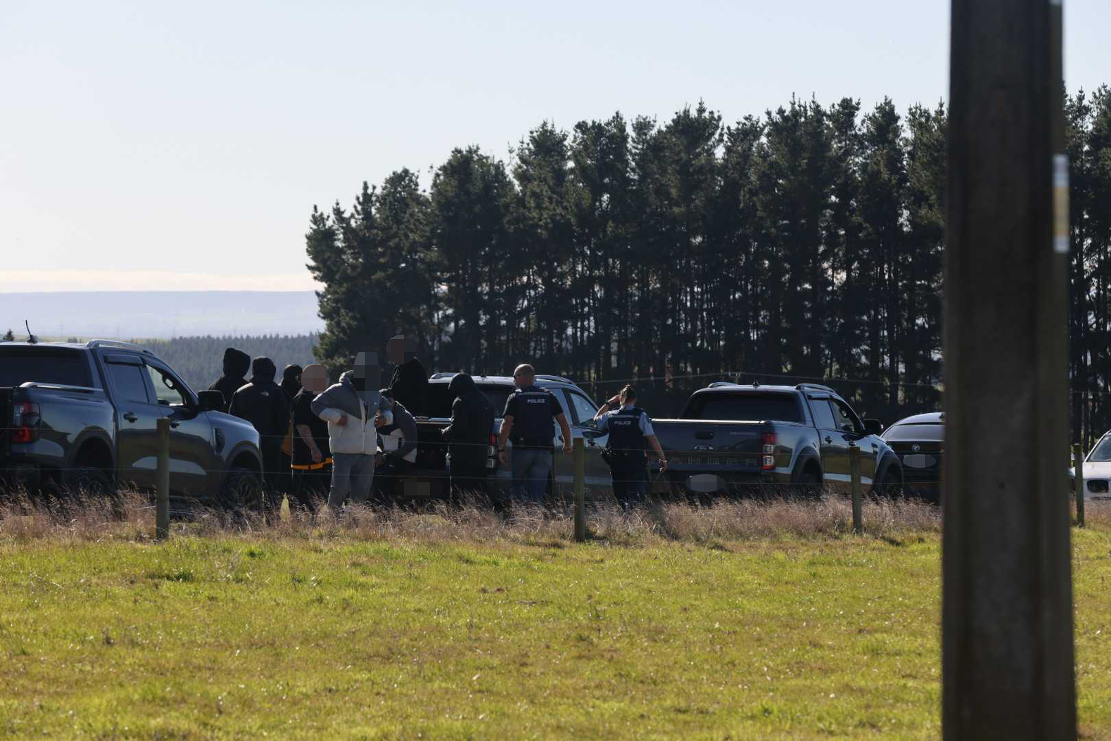 A convoy of cars has arrived at the rural property where the suspect in the Ponsonby shooting has been found dead. Photo / Andrew Warner