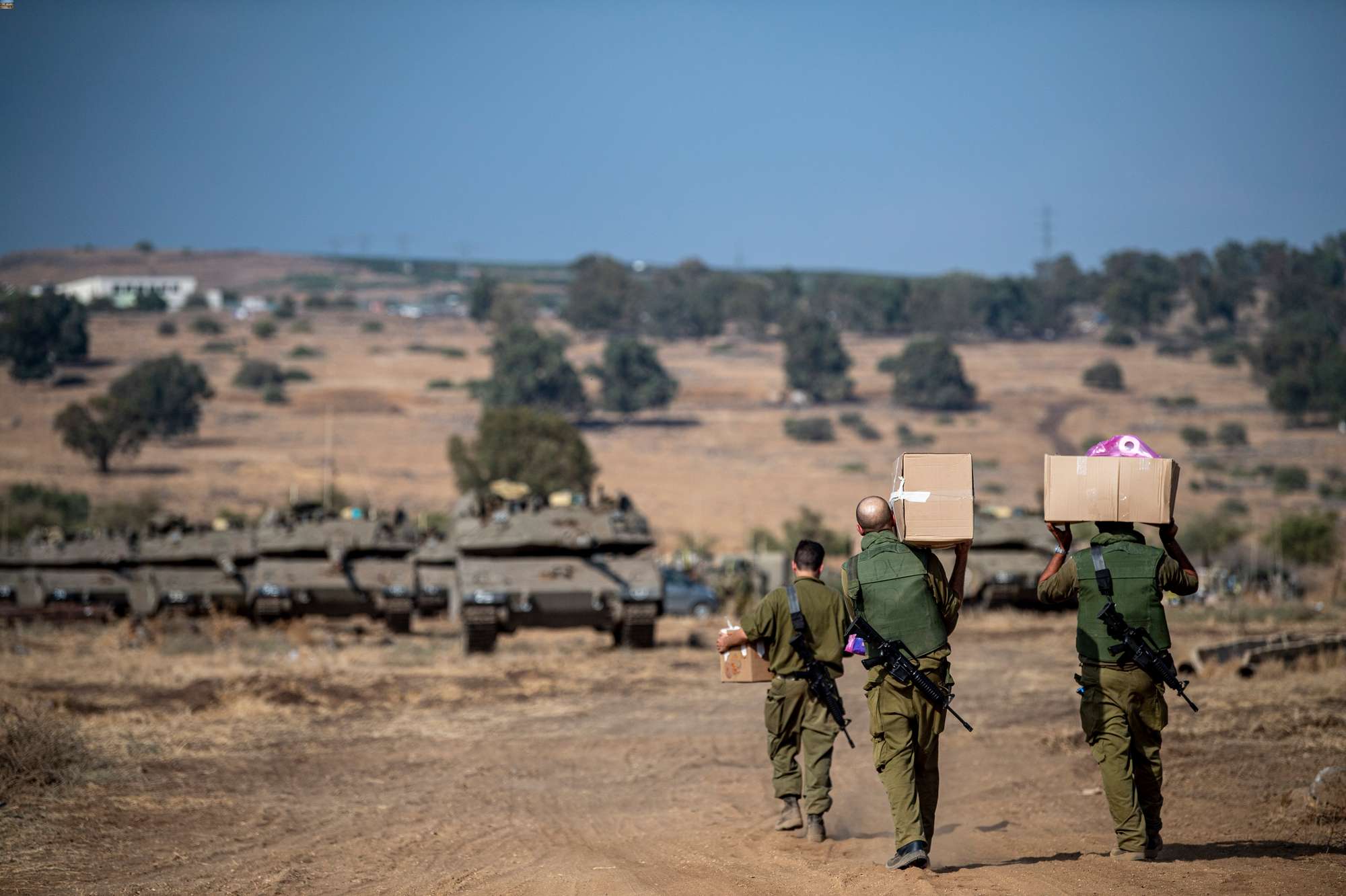 Israeli soldiers carry supplies near the border with Lebanon on October 10. Photo / AP