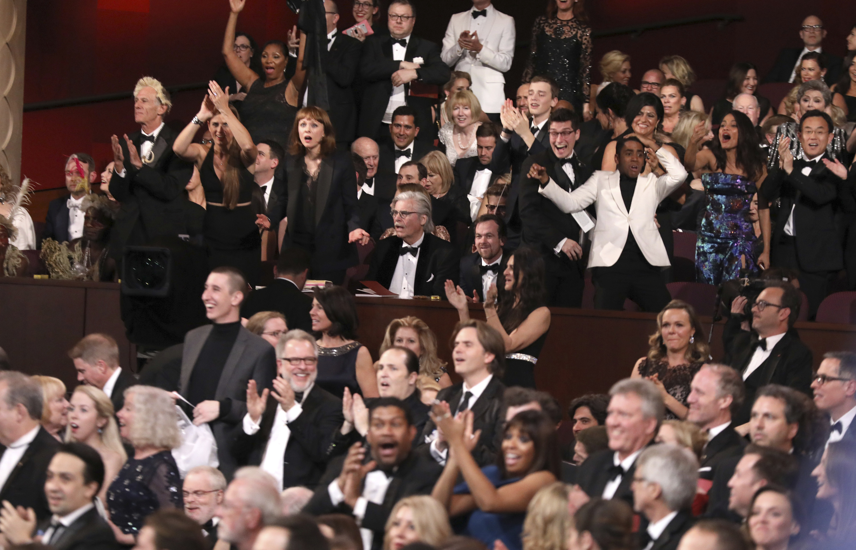 The cast of Moonlight celebrates as Moonlight wins the best picture award at the Oscars after La La Land was incorrectly named the winner. Photo/AP