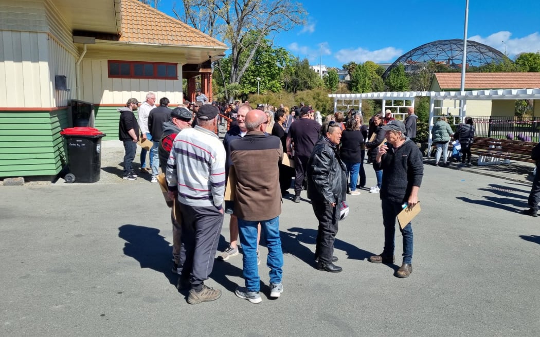 Workers after a surprise meeting at the Smithfield meatworks in Timaru last month, where they were told they could lose their jobs. Photo / Tim Brown, RNZ