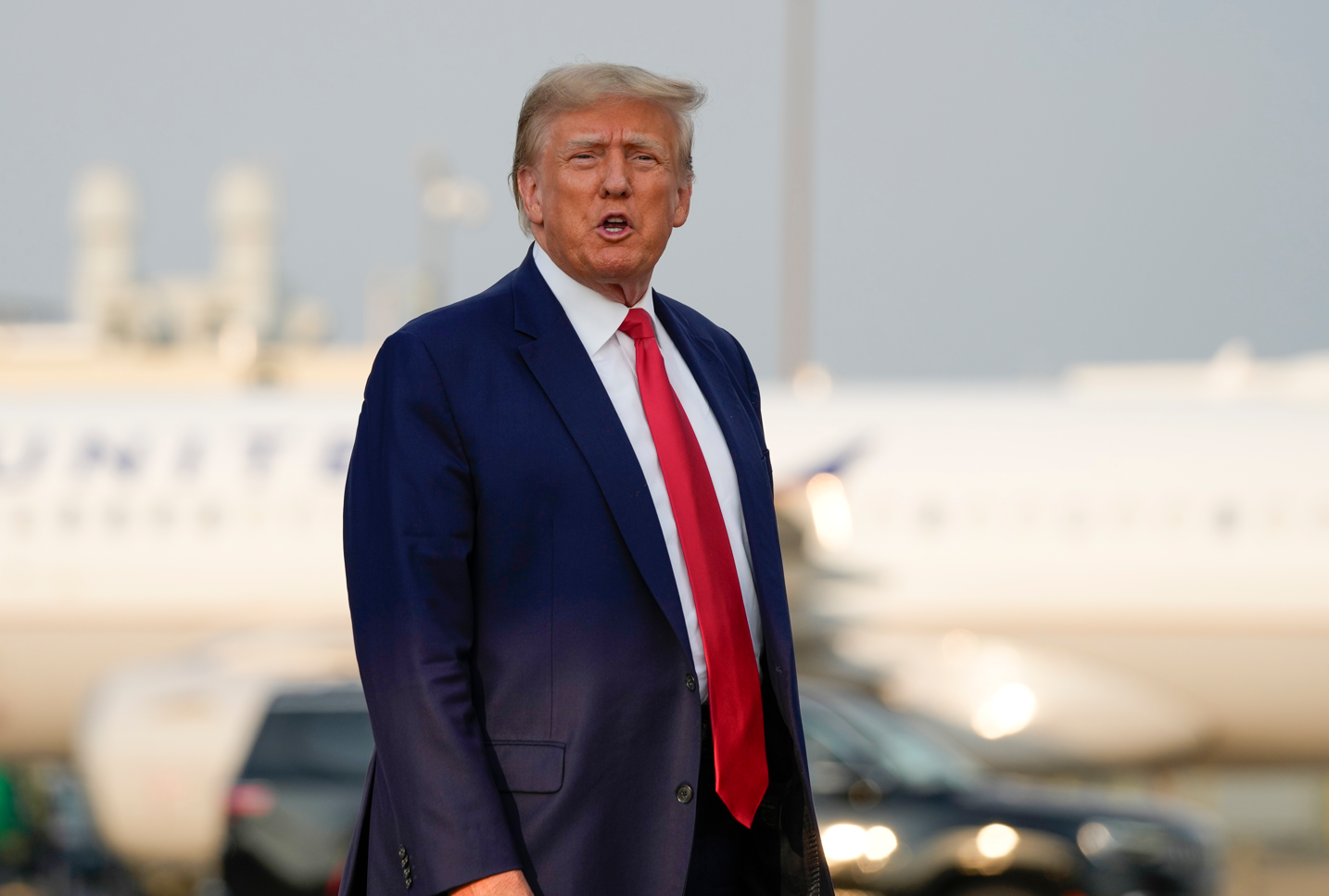 Former President Donald Trump steps off his plane as he arrives at Hartsfield-Jackson Atlanta International Airport in Atlanta. Photo / AP