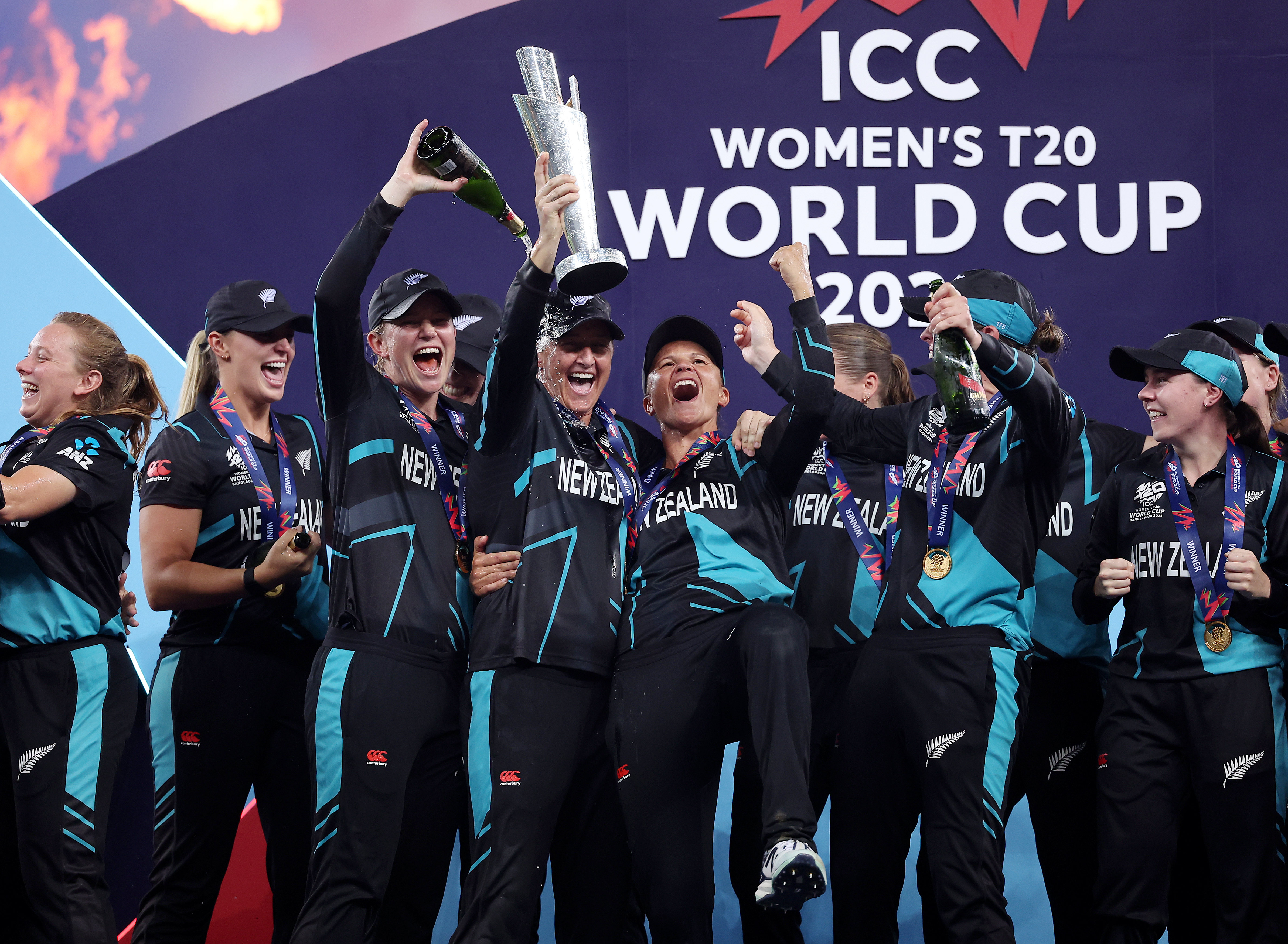 New Zealand captain Sophie Devine lifts the ICC Women's T20 World Cup Trophy as she celebrates with teammates after defeating South Africa. Photo / Getty Images