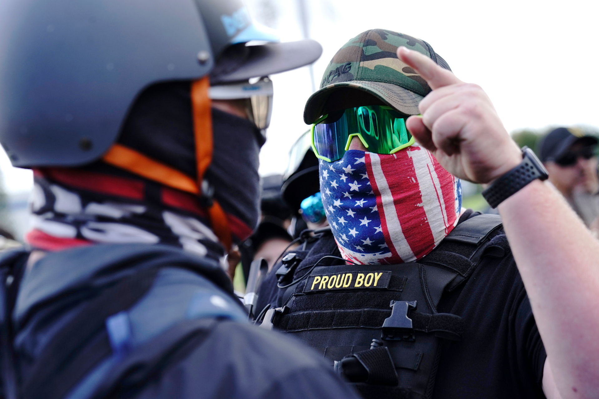 A right-wing demonstrator gestures toward a counter protester as members of the Proud Boys and other right-wing demonstrators rally in Portland. Photo / AP