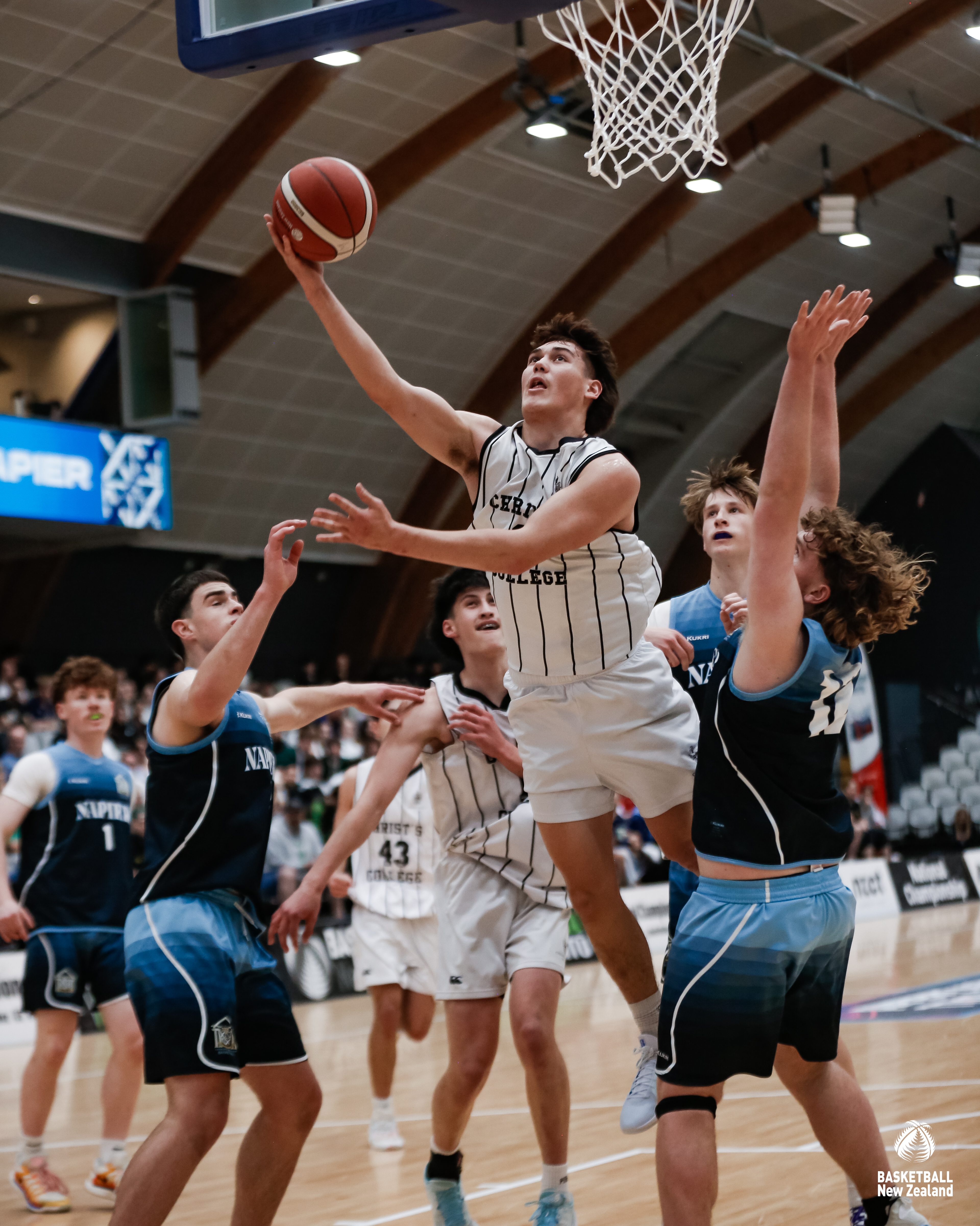 Tama Isaac driving to the hoop against Napier Boys' High School in the National Secondary Schools final. Photo / BBNZ