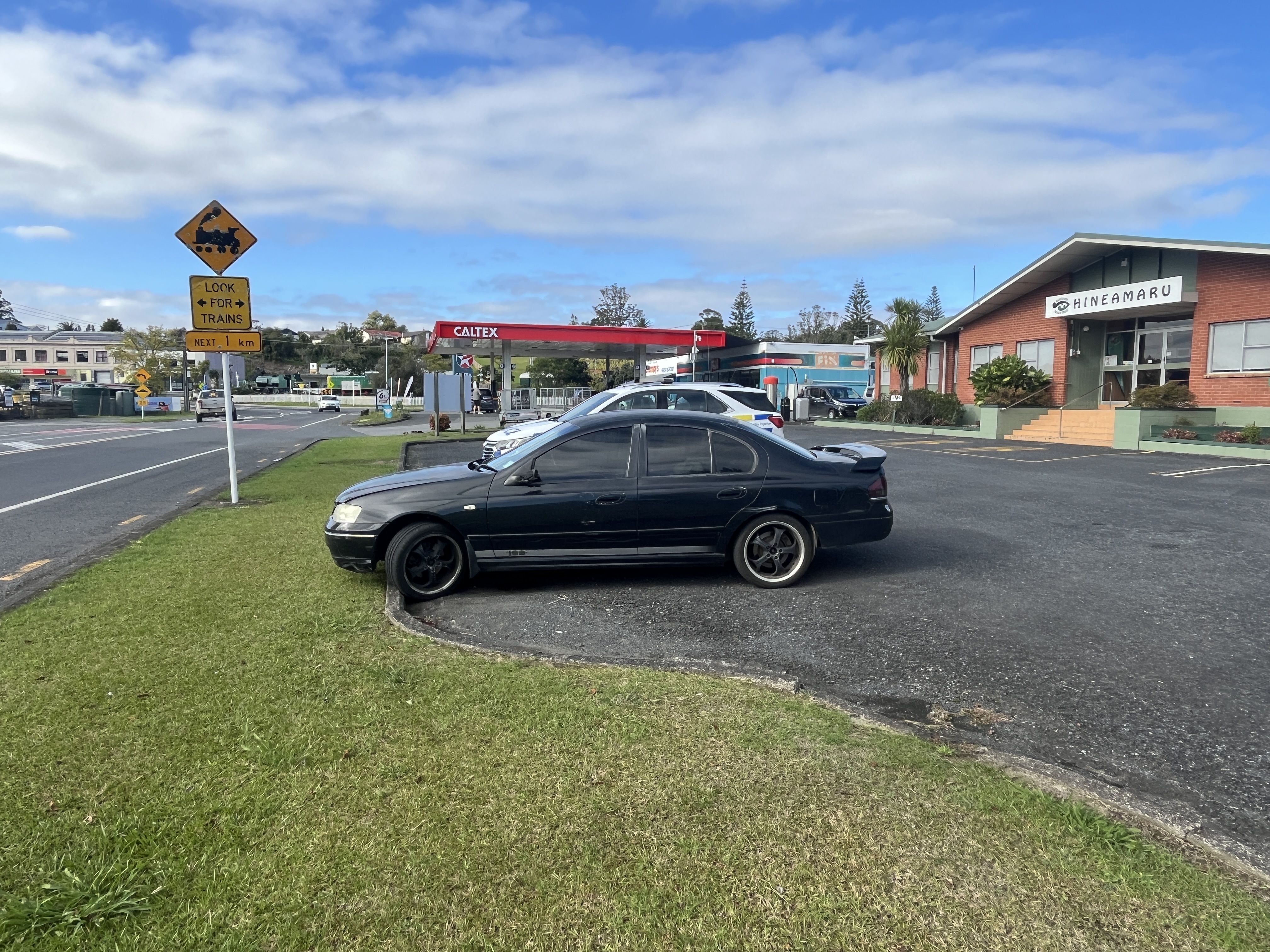 Northland police are seeking sightings of a black Ford Falcon, with registration number BYM765, which visited the Caltex service station (rear) around 7.15am on Sunday. Photo / NZ Police