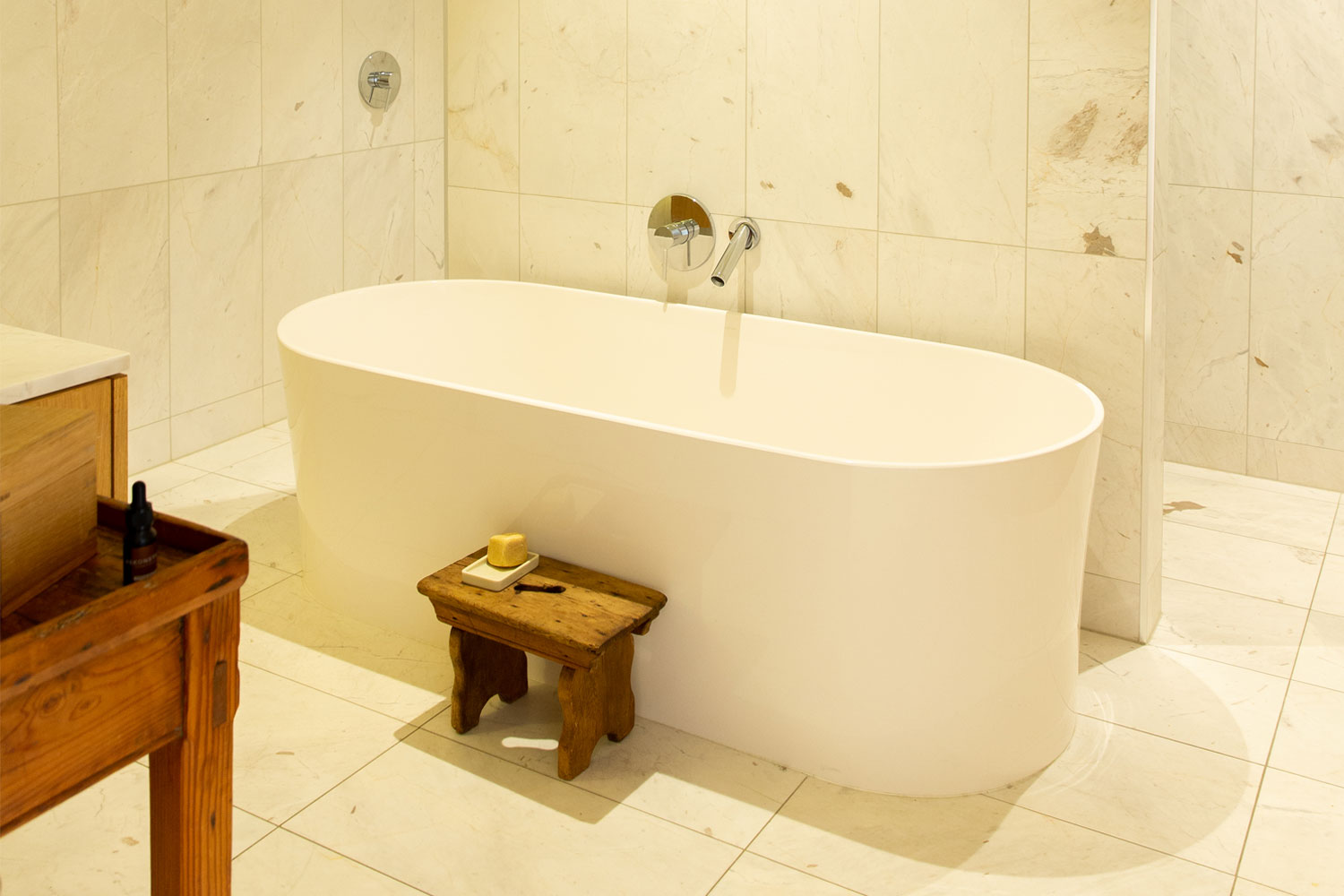 The bathroom features a marble finish. Photo / Babiche Martens