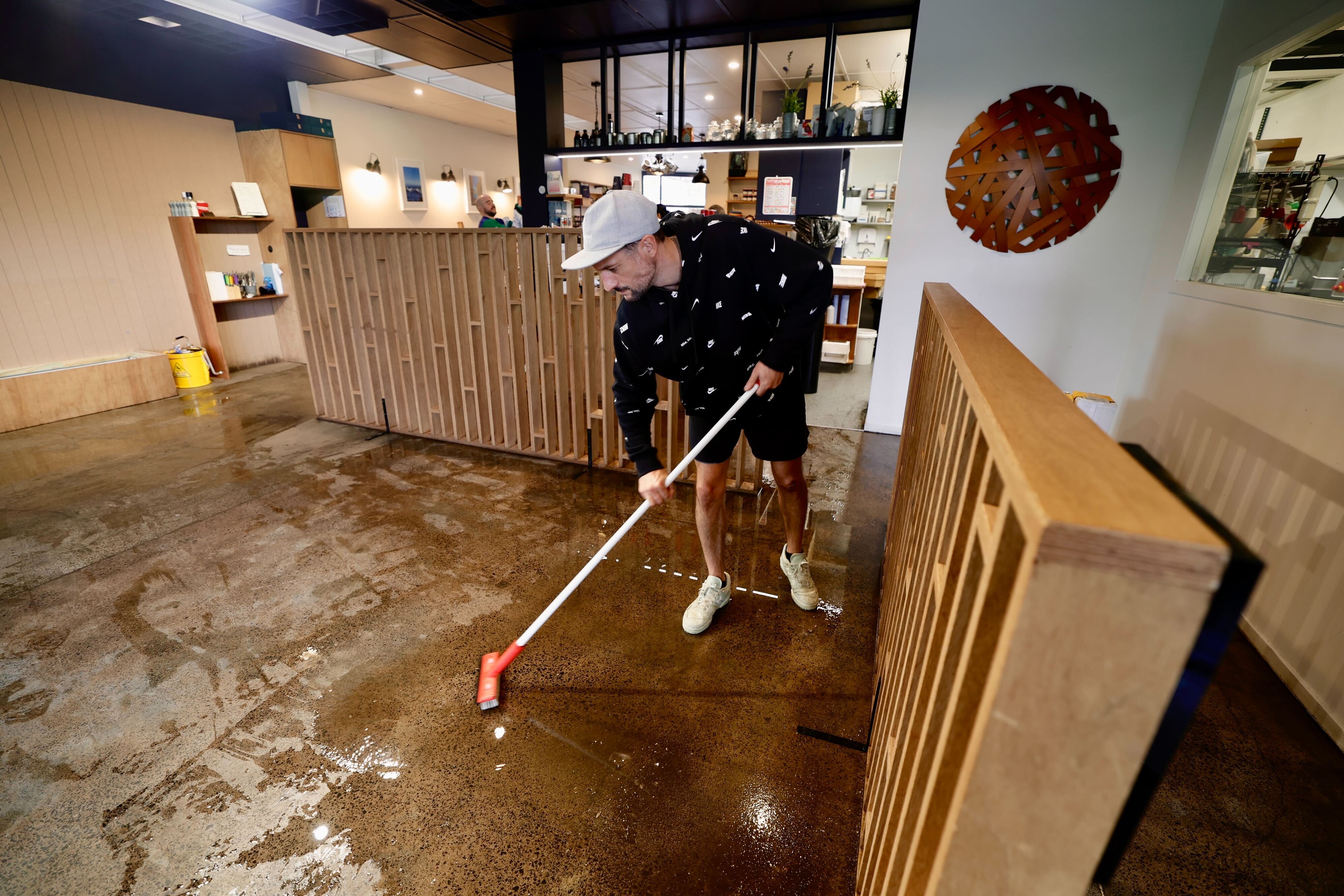 Benjamin Chevre and his team at the Little French Cafe in Mt Albert were in clean-up mode after the storm. Photo / Dean Purcell