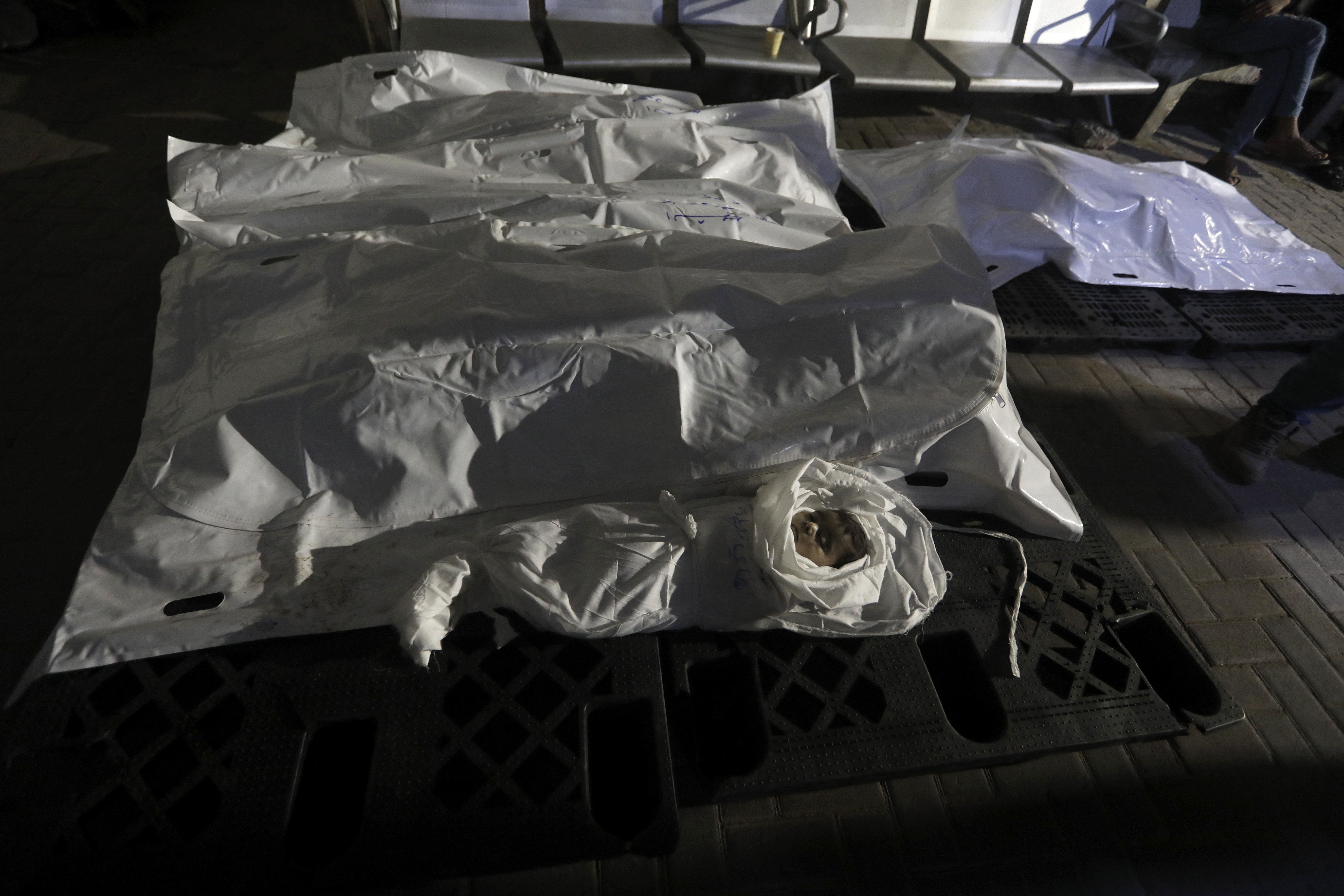 The Qeshta family is seen in body bags at the morgue of Al Najjar hospital in Rafah. The family was killed in an Israeli bombardment on a residential building in Rafah. Photo / AP
