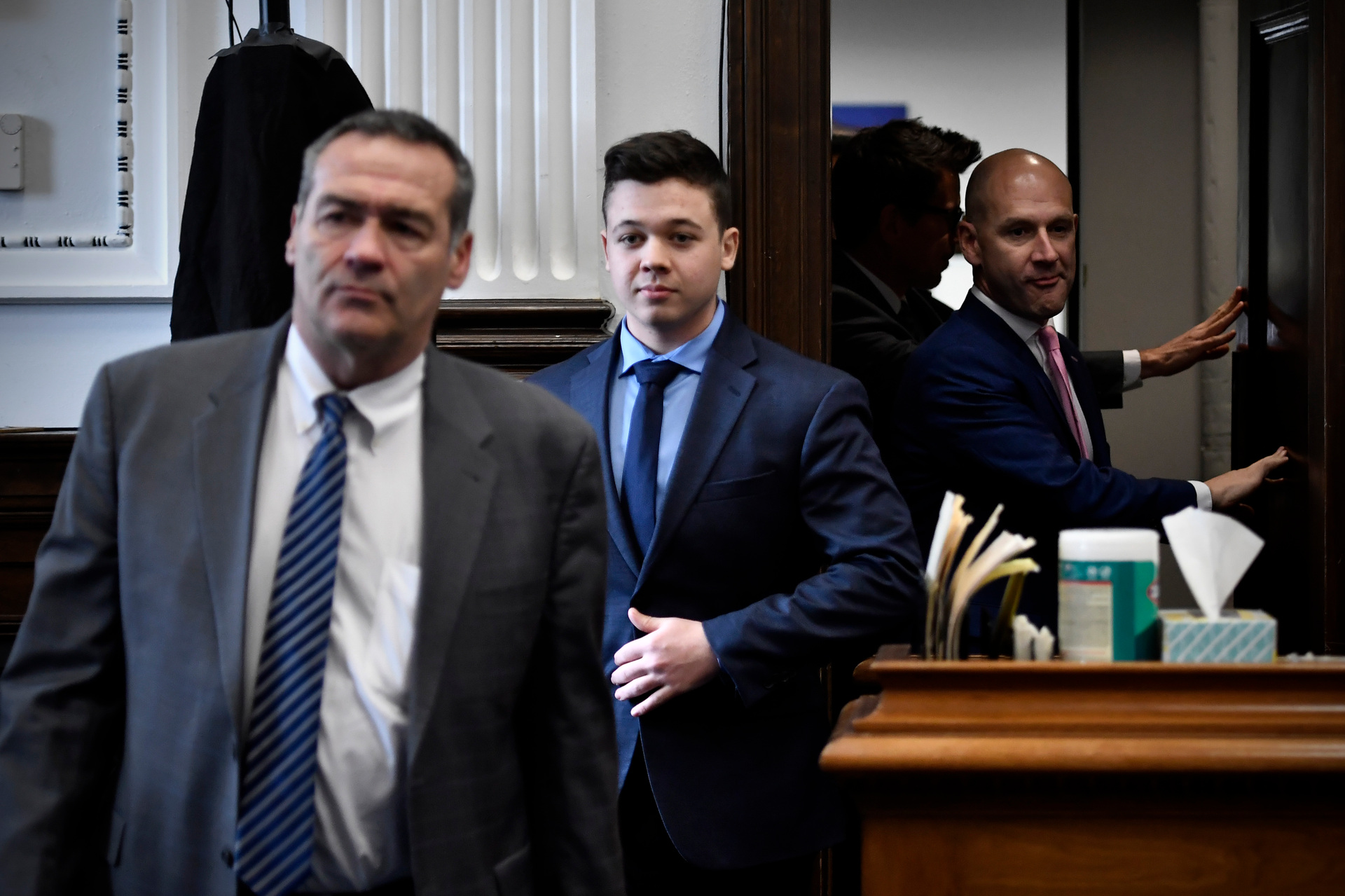 Kyle Rittenhouse, centre, enters the courtroom with his attorneys Mark Richards, left, and Corey Chirafisi. Photo / AP